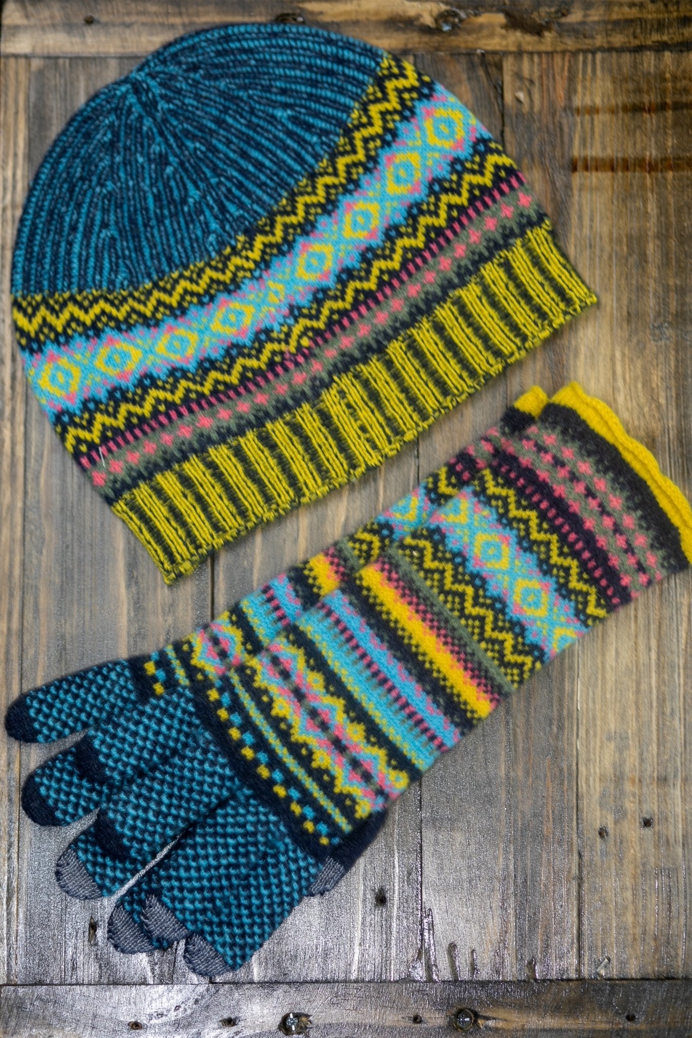 Northern Isles Merino Wool Beanie and Gloves in Blue on a wood background - L'Atelier Global