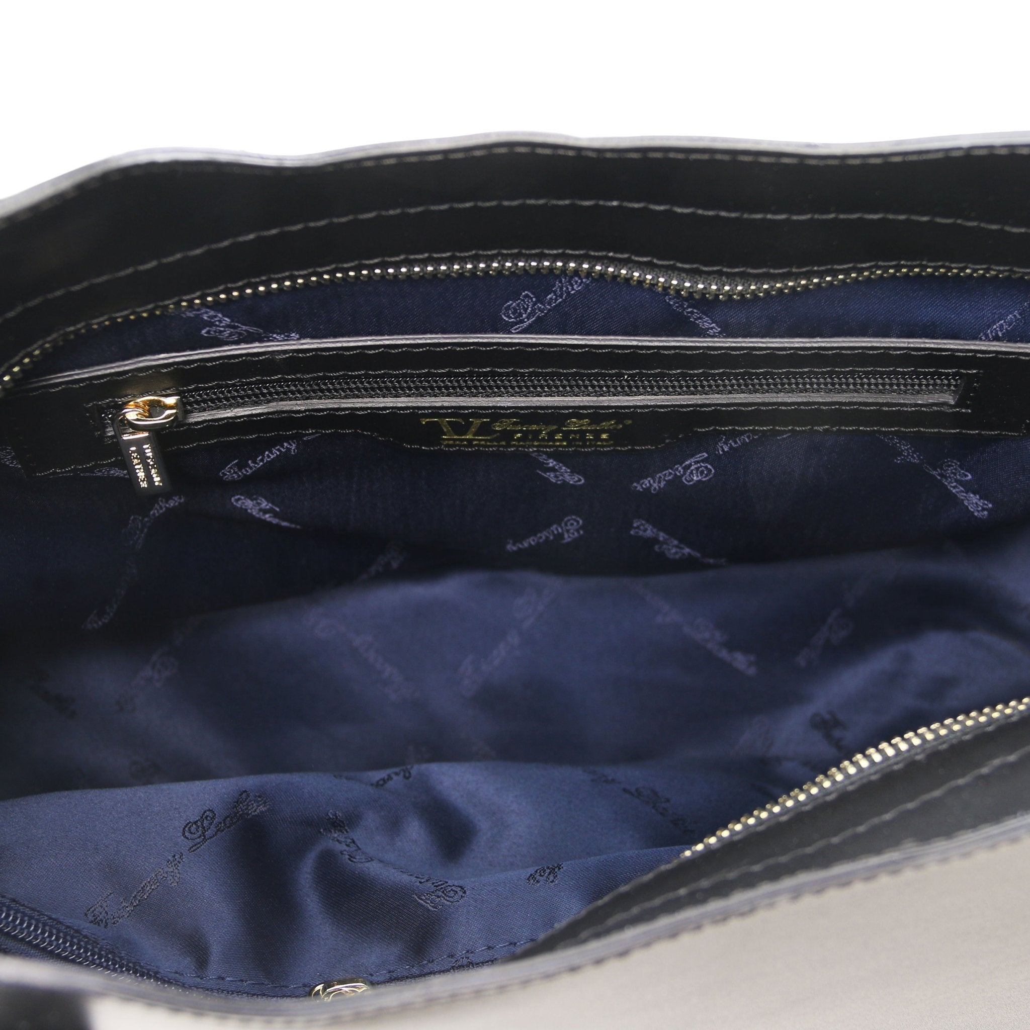 Interior Zip Pocket View Olimpia Leather Tote in Black Small Size showing navy lining