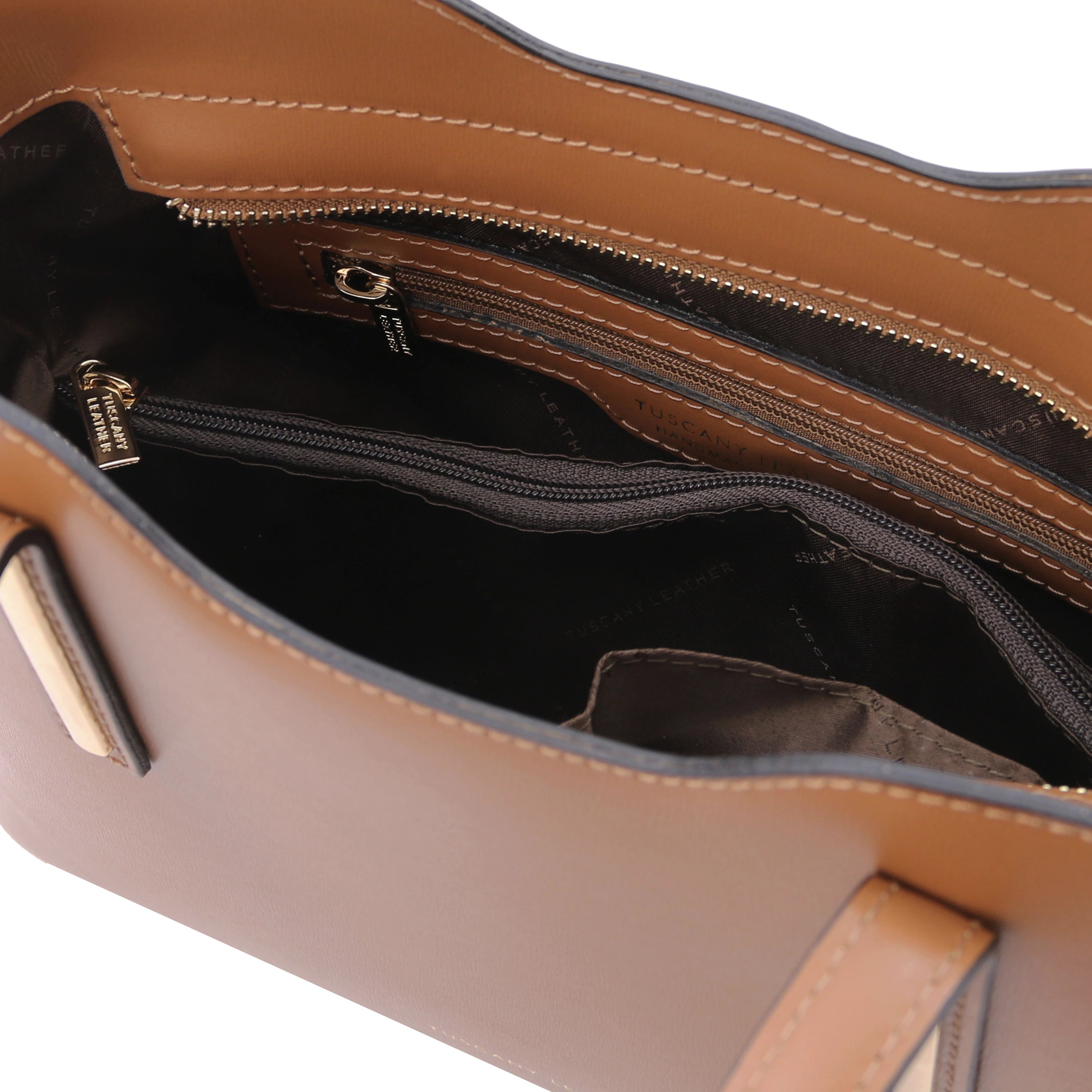 Interior Zip Pocket View Olimpia Leather Tote in Cognac Small Size showing dark brown lining