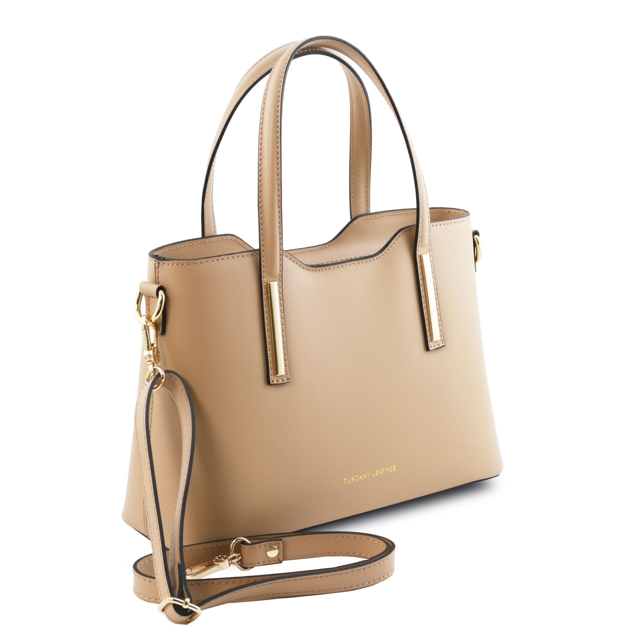 Front Angled View Olimpia Leather Tote in champagne Small Size showing handle and shoulder strap
