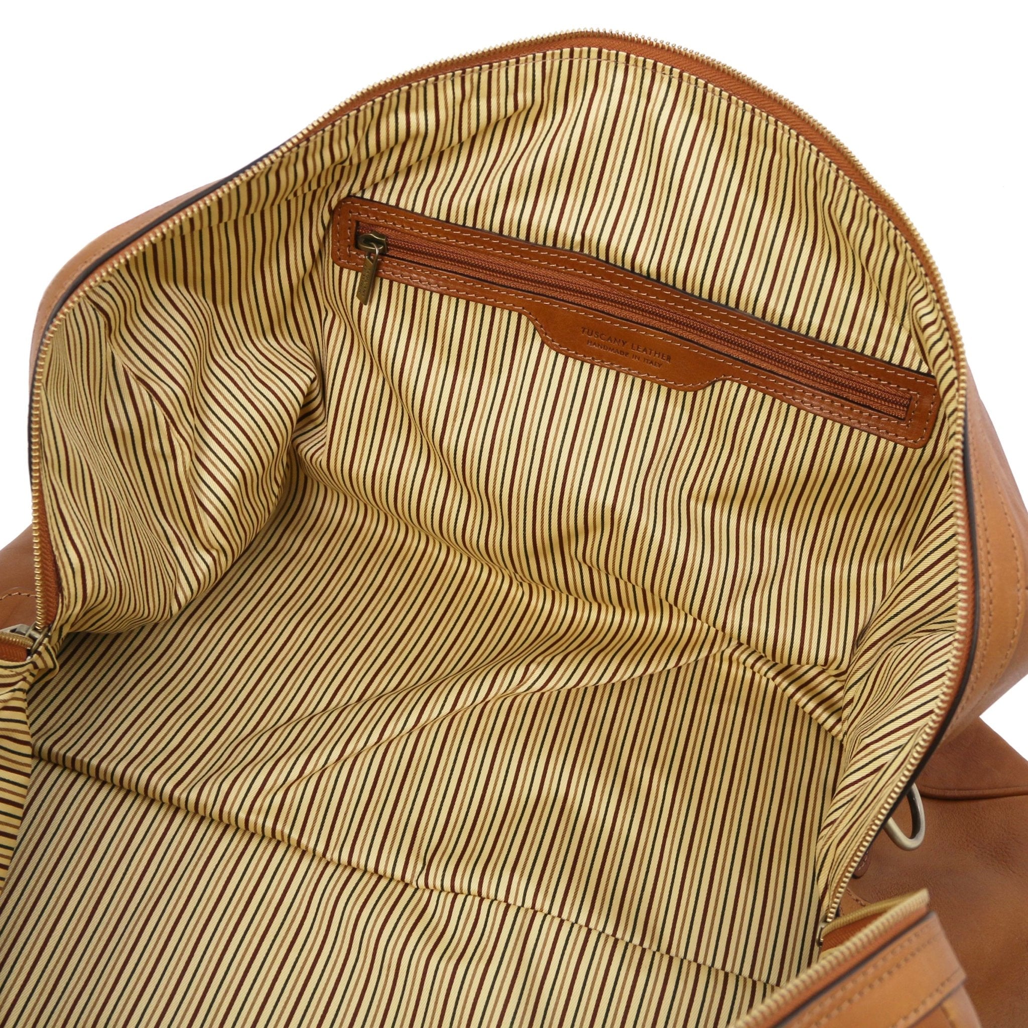 Interior zip pocket view Oslo Travel Leather Weekender Duffle Bag in Natural showing vintage striped cotton ticking lining