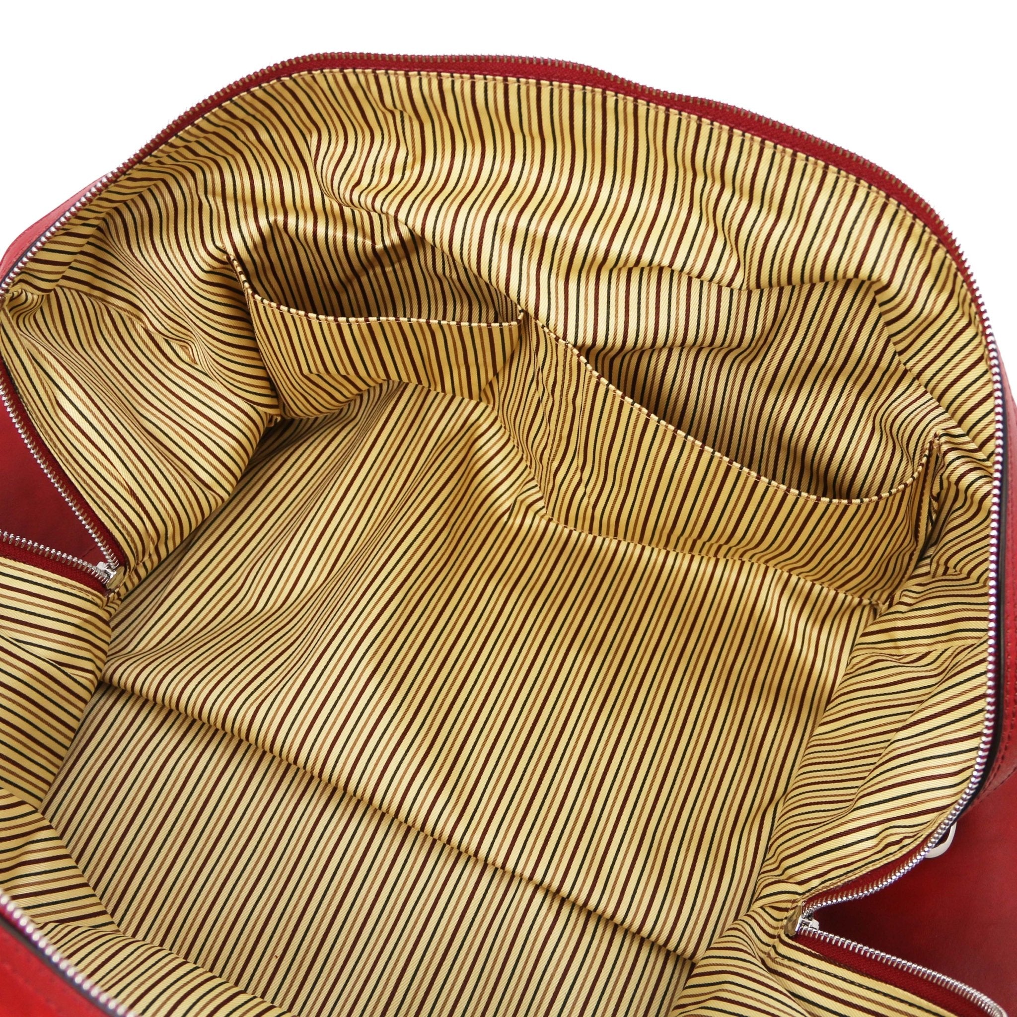 Interior open pocket view Oslo Travel Leather Weekender Duffle Bag in red showing vintage striped cotton ticking lining