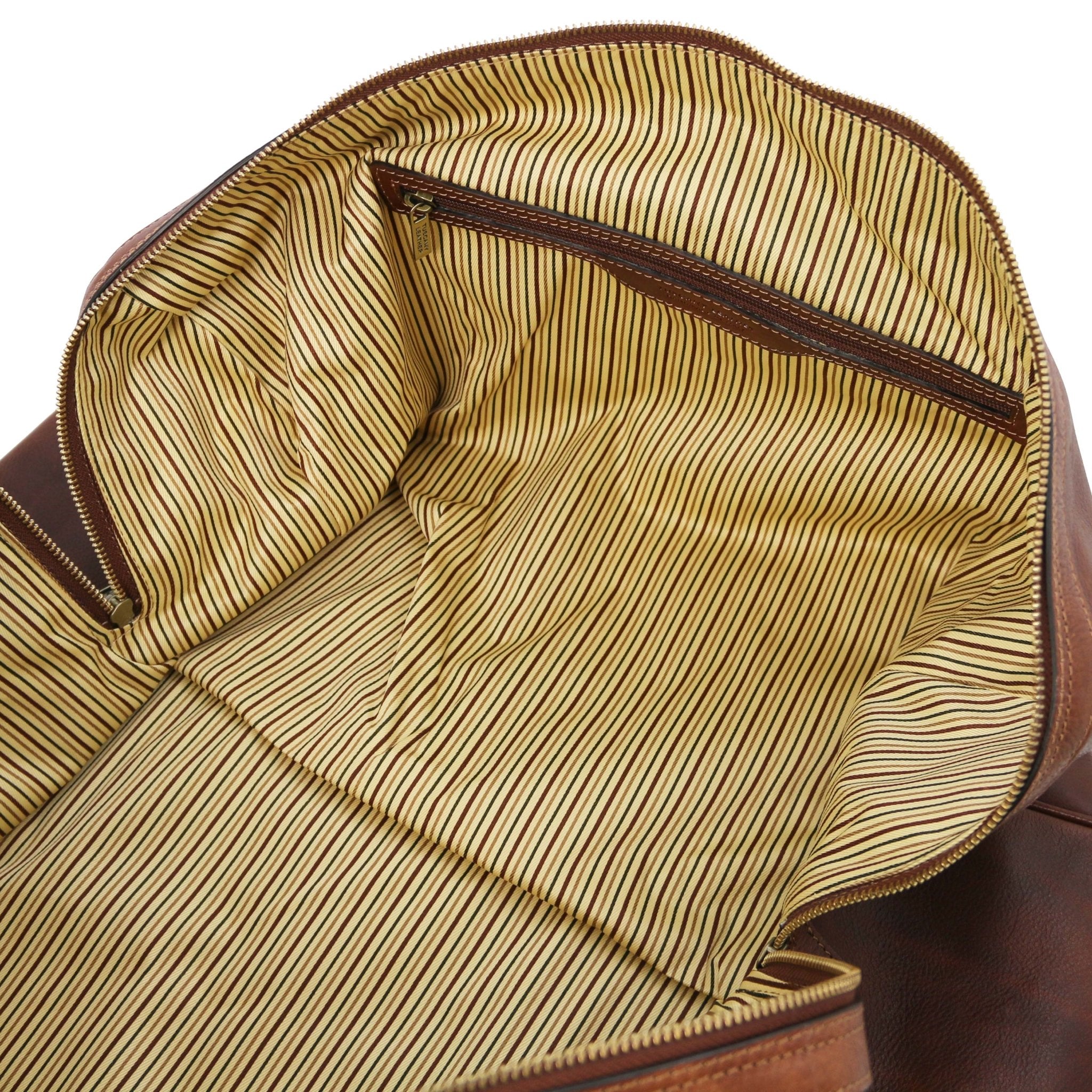 Interior zip pocket view Oslo Travel Leather Weekender Duffle Bag in Brownshowing vintage striped cotton ticking lining
