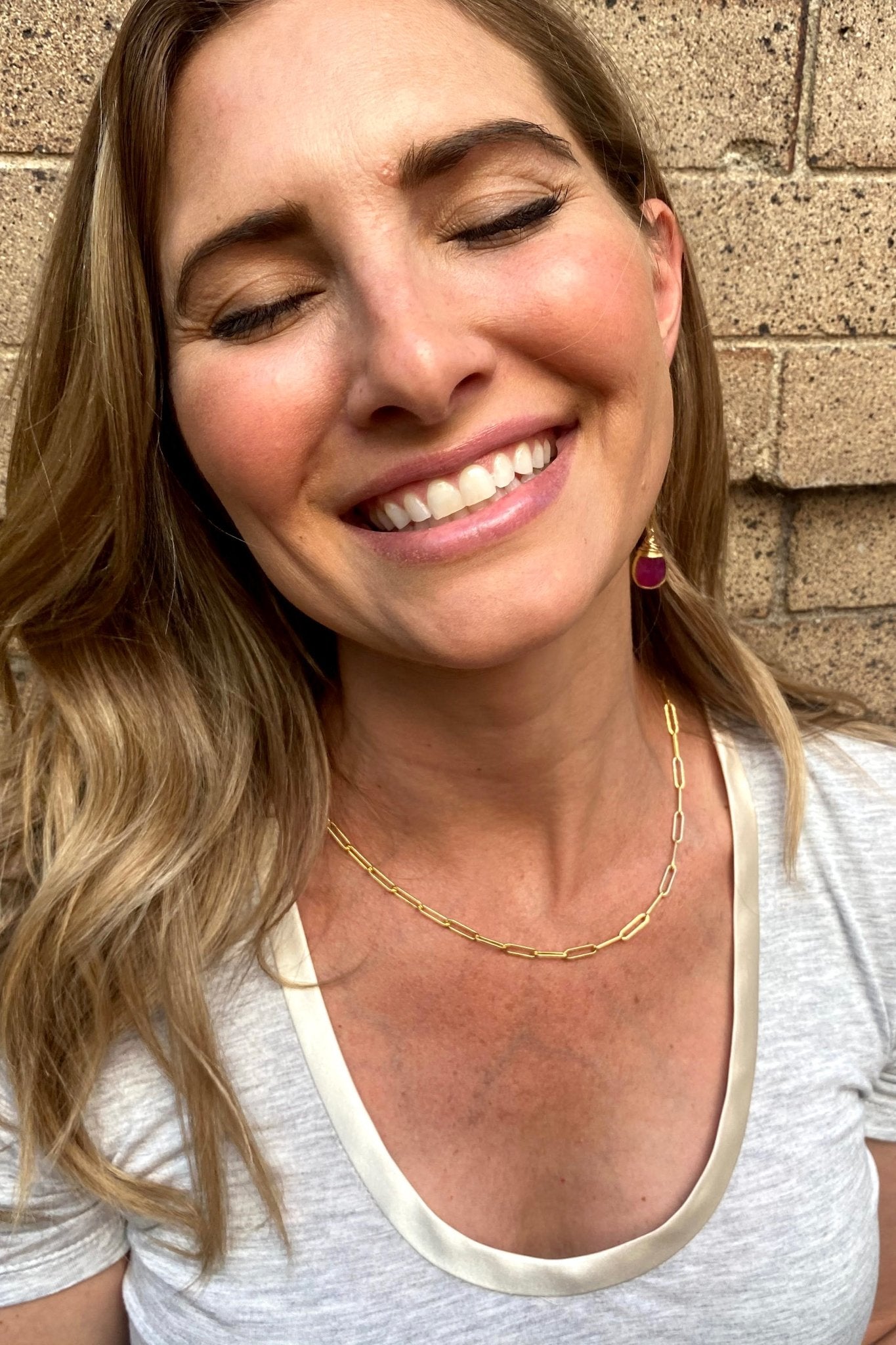 Paperclip Link Gold Signature Necklace on model wearing a white shirt