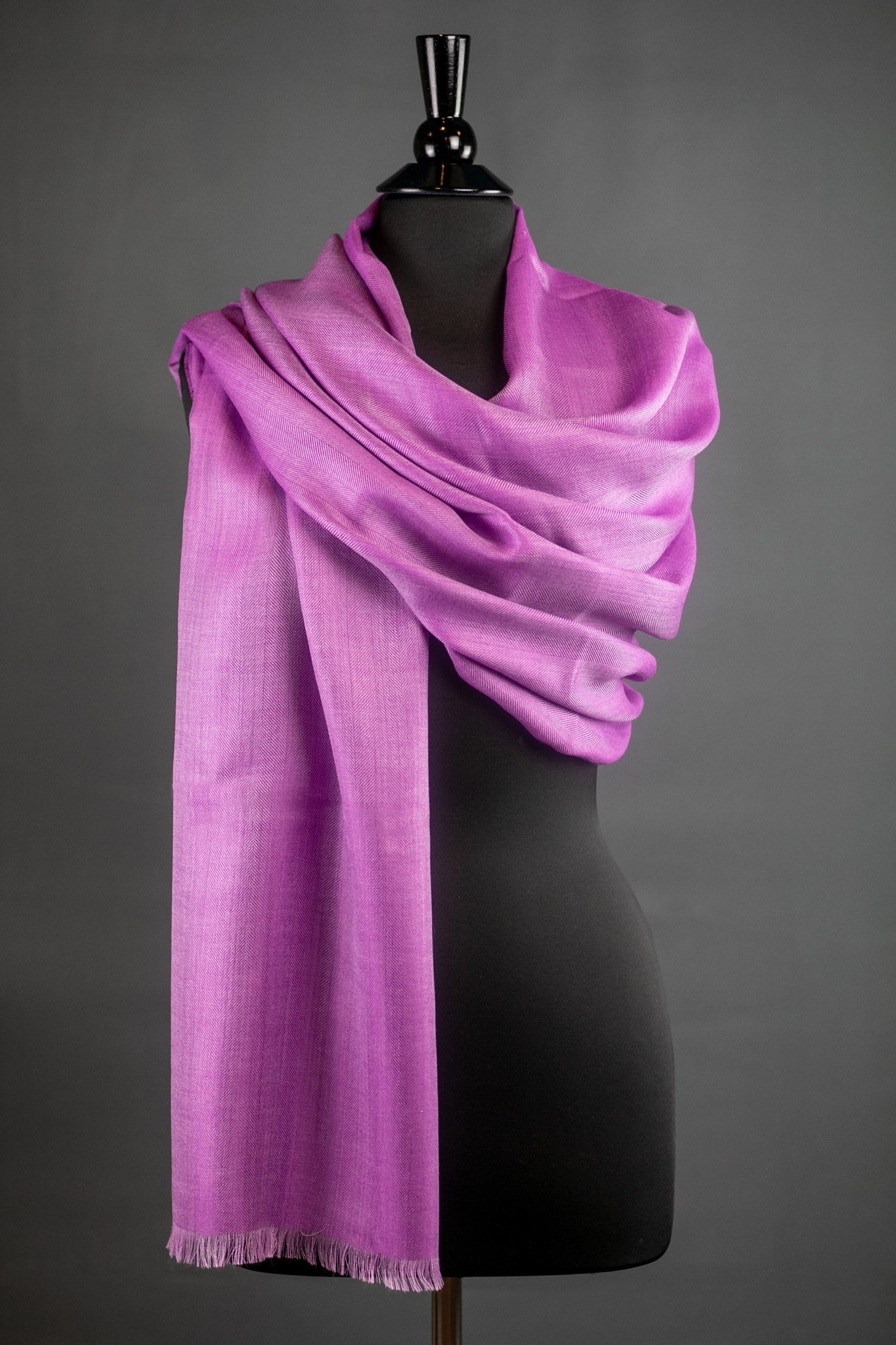 Peruvian Baby Alpaca and Silk Stole in Light Berry al wrapped on a black bust form with a dark gray background