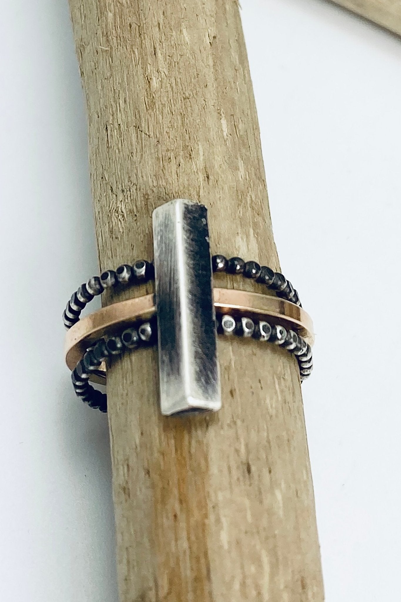 Pyramid Stacking Rings on a wooden dowel - L'Atelier Global