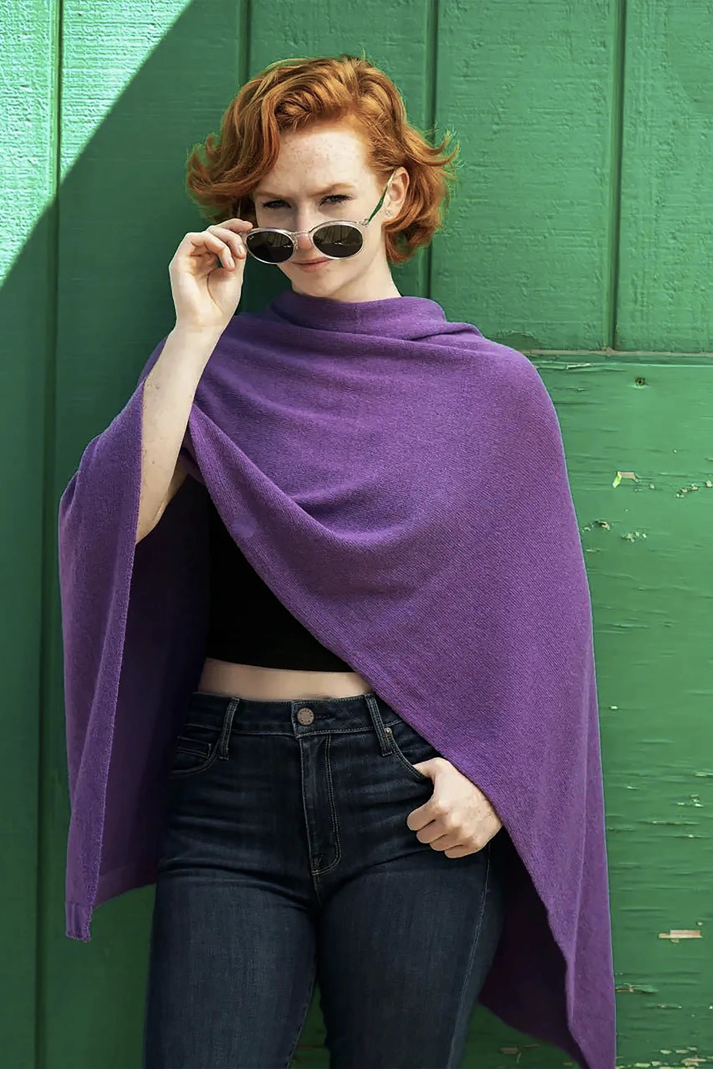 Roma Cashmere Blend Asymmetrical Poncho in purple on model wearing a black crop top and blue jeans - L'Atelier Global