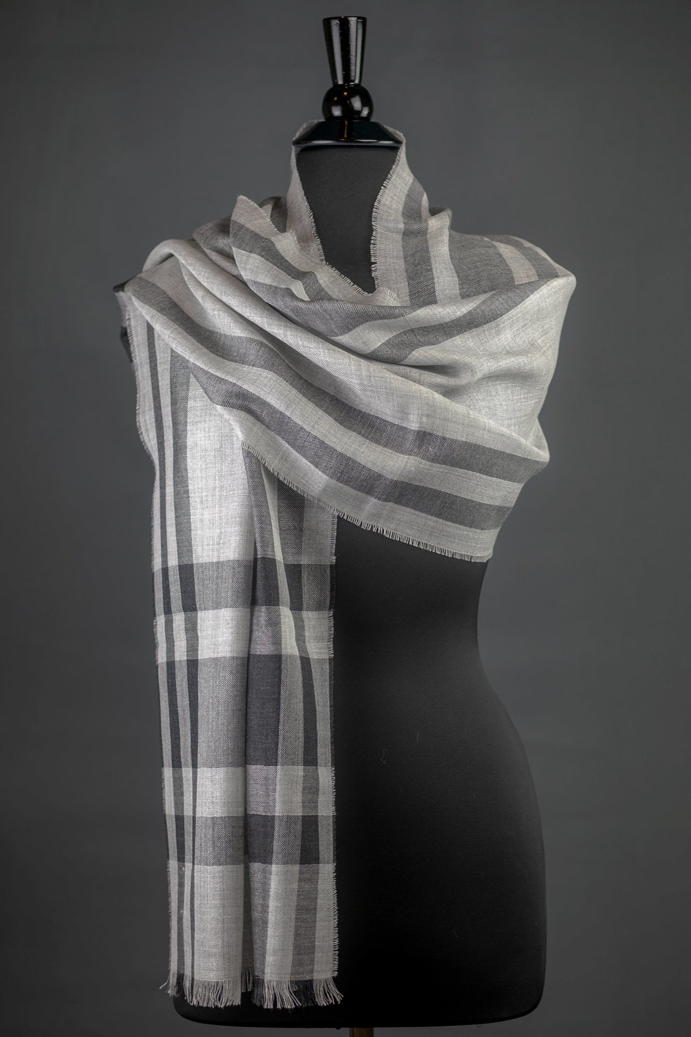 Sachacha Peruvian Baby Alpaca and Silk Stole in warm gray on a black bust form with a daky gray background