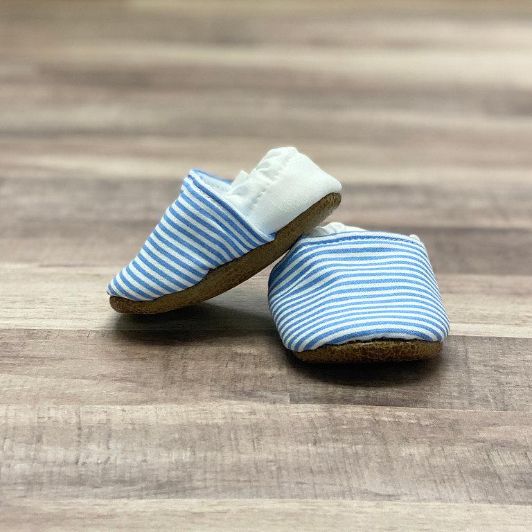 Sailor Striped Cotton Canvas Moccasins on a soft ash hued wood table
