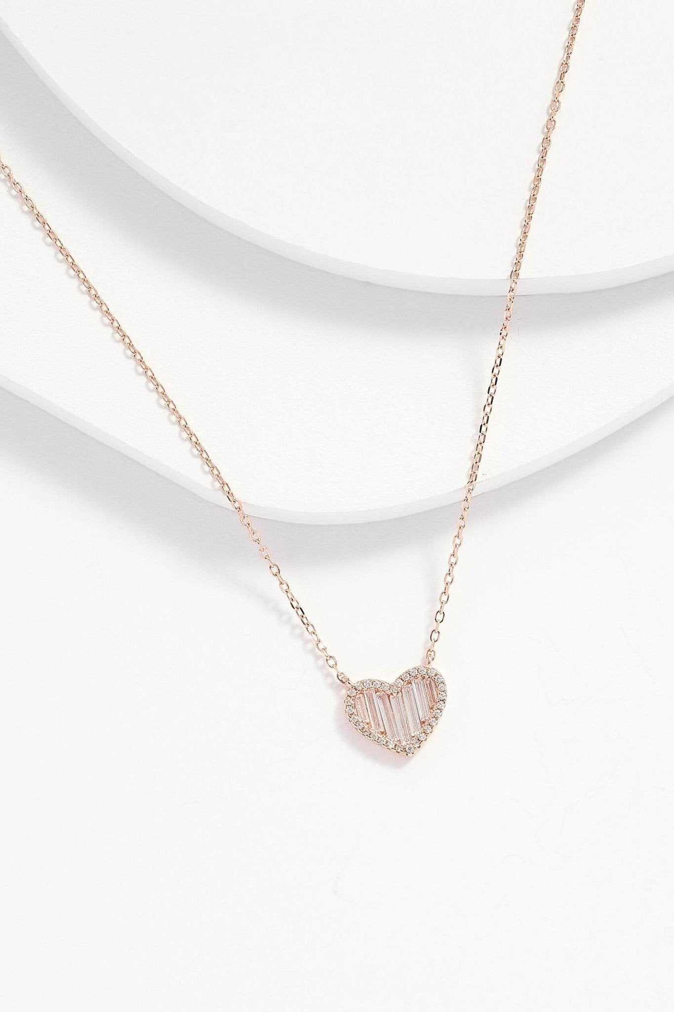 San Lorenzo Heart Shaped Pendant Necklace on a white textured background - L'Atelier Global