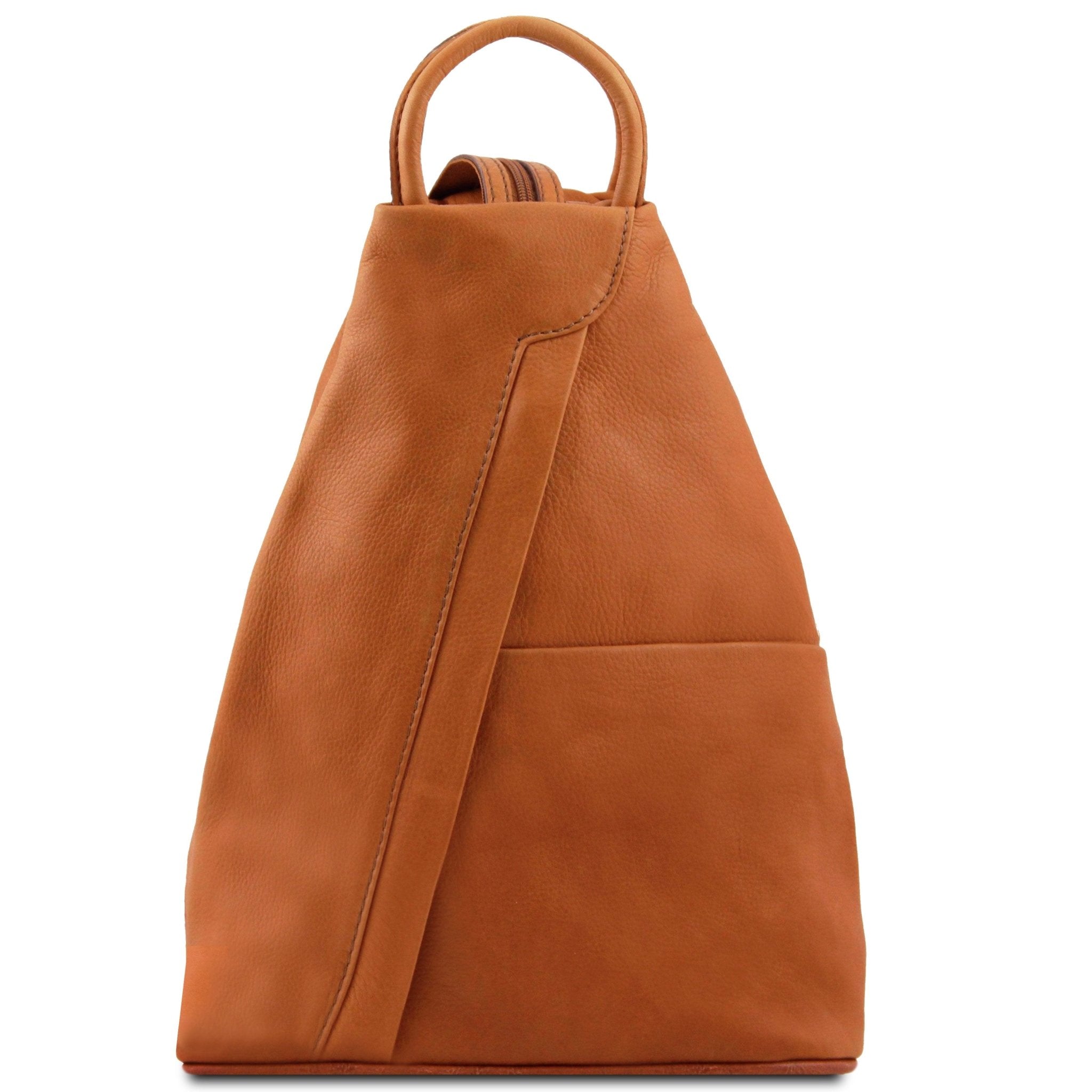 Shanghai Full Grain Leather Backpack in cognac front view showing front angled zip and open pocket
