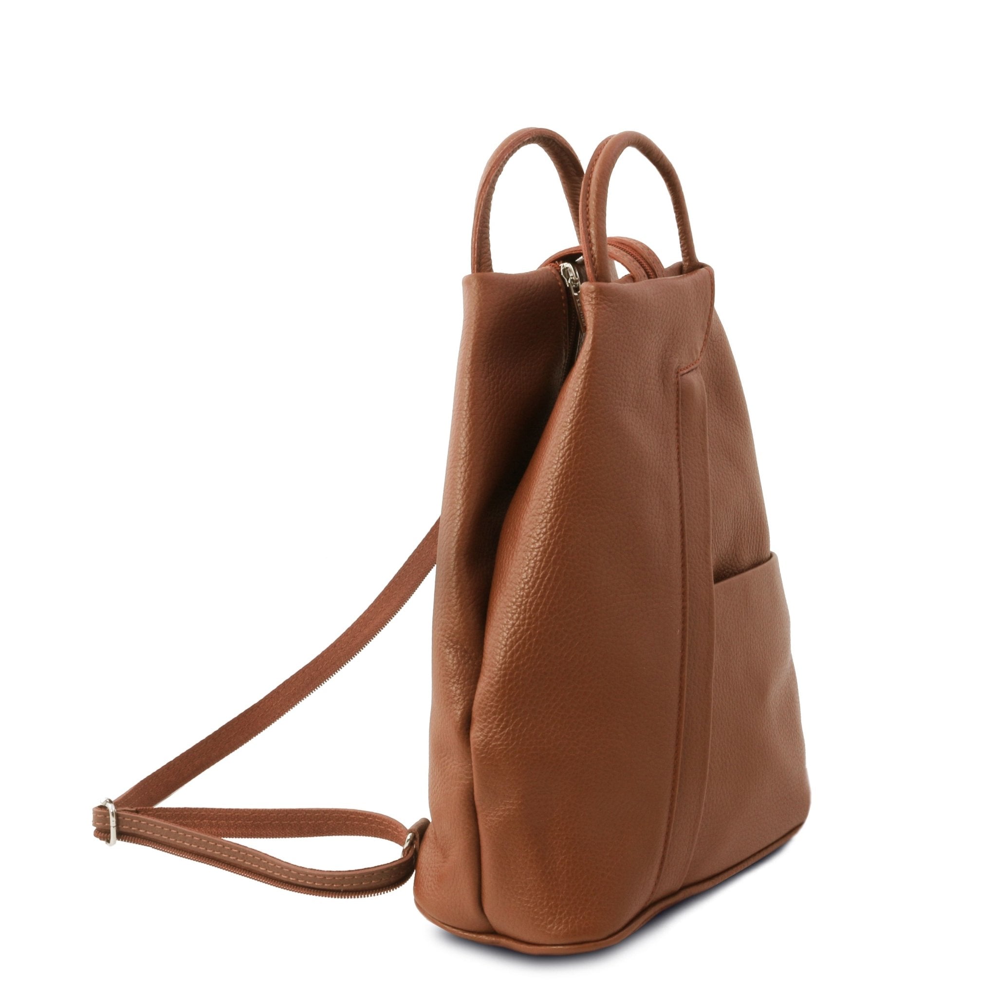 Shanghai Leather Backpack in cognac front angled view showing front angled zip and open pockets, handle and sling back strap