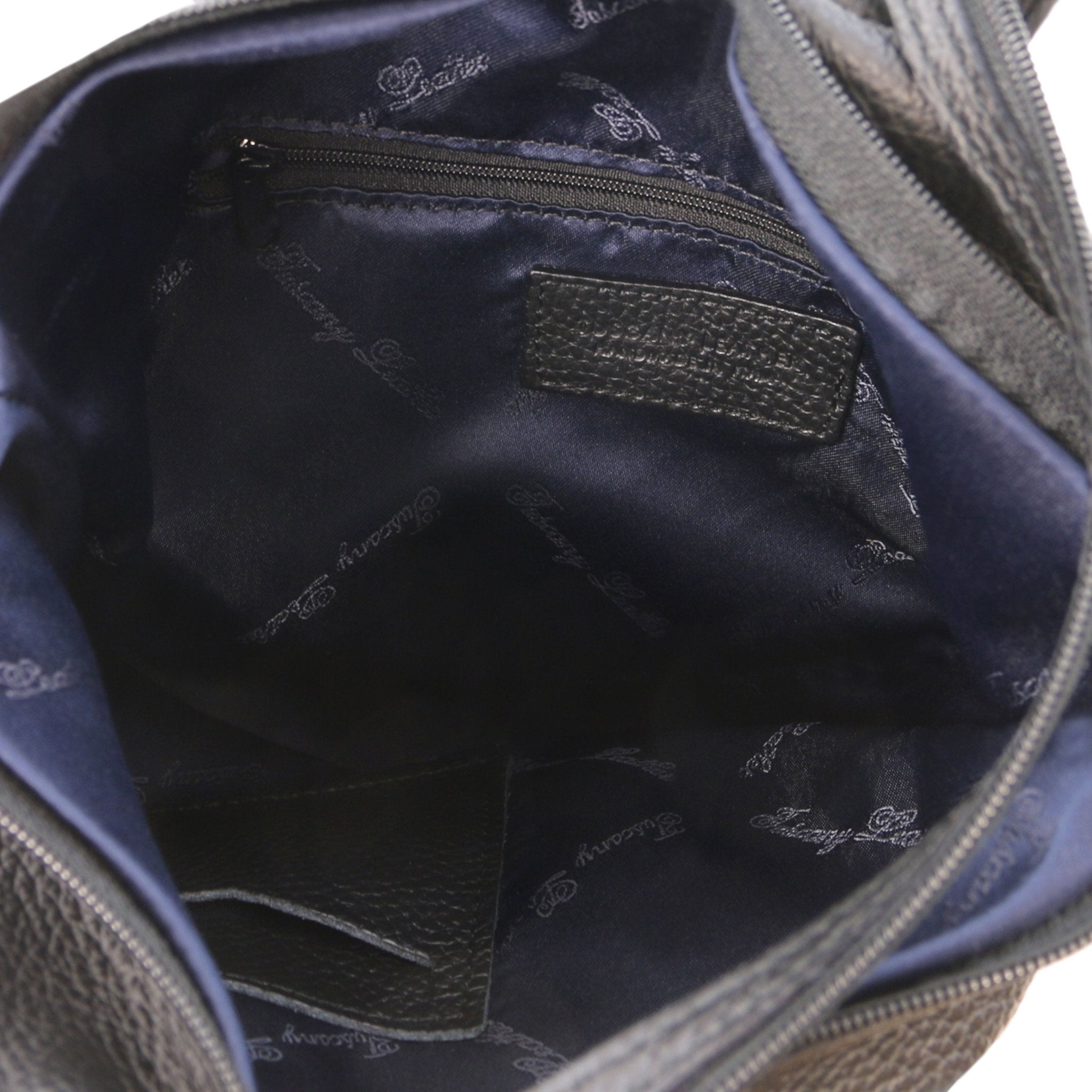 Interior zip pocket view Shanghai Leather Backpack in black showing navy blue lining