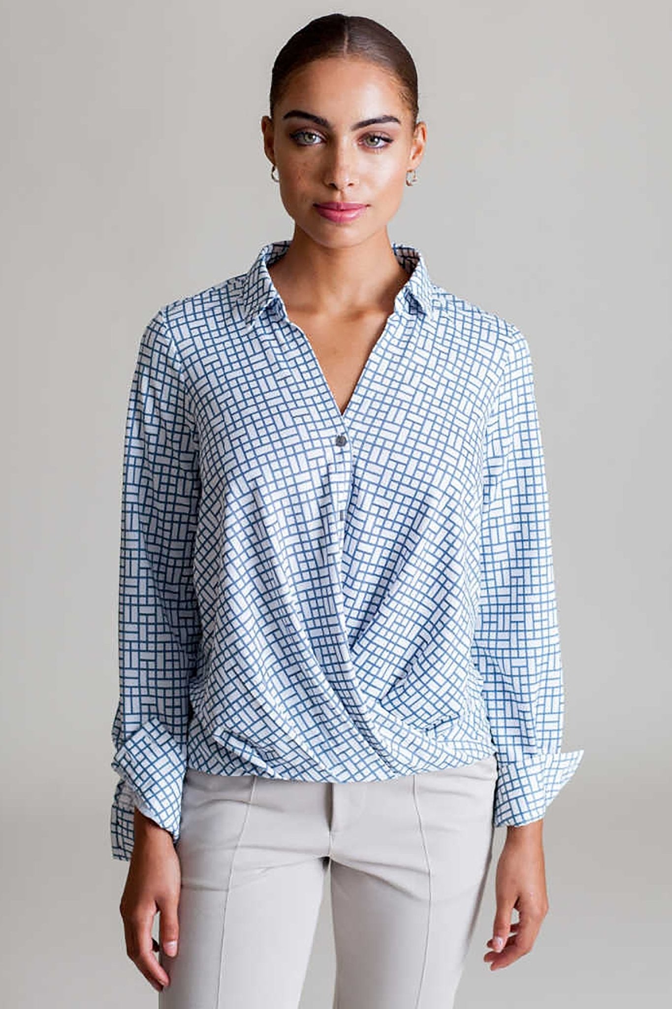 Front view of a model wearing the Signature Barcelona Blouse in Blue Check - L'Atelier Global