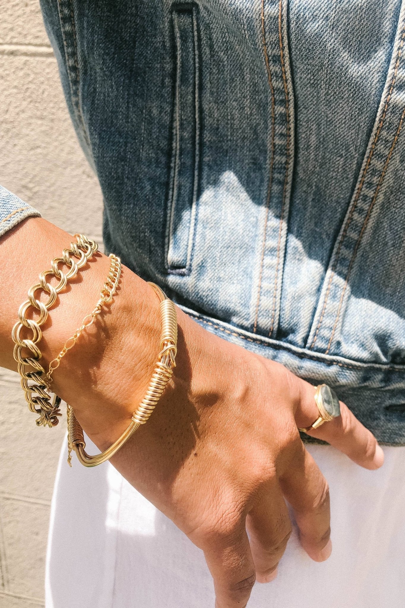 Signature Curb Link Gold Bracelet on models wrist