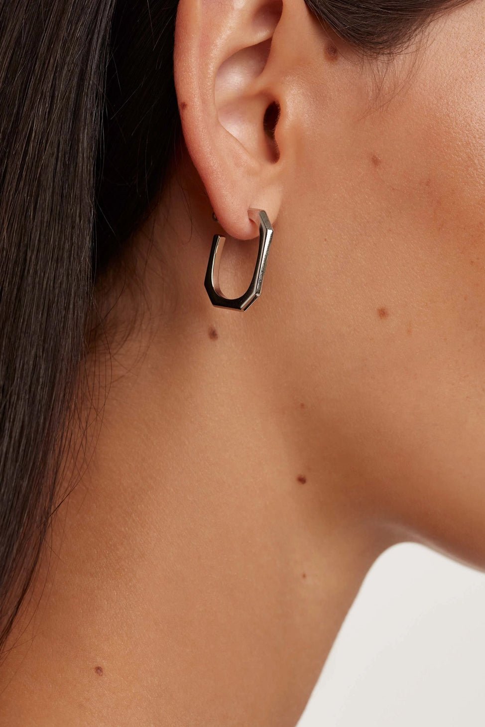 Signature Link Silver Earrings on a female model