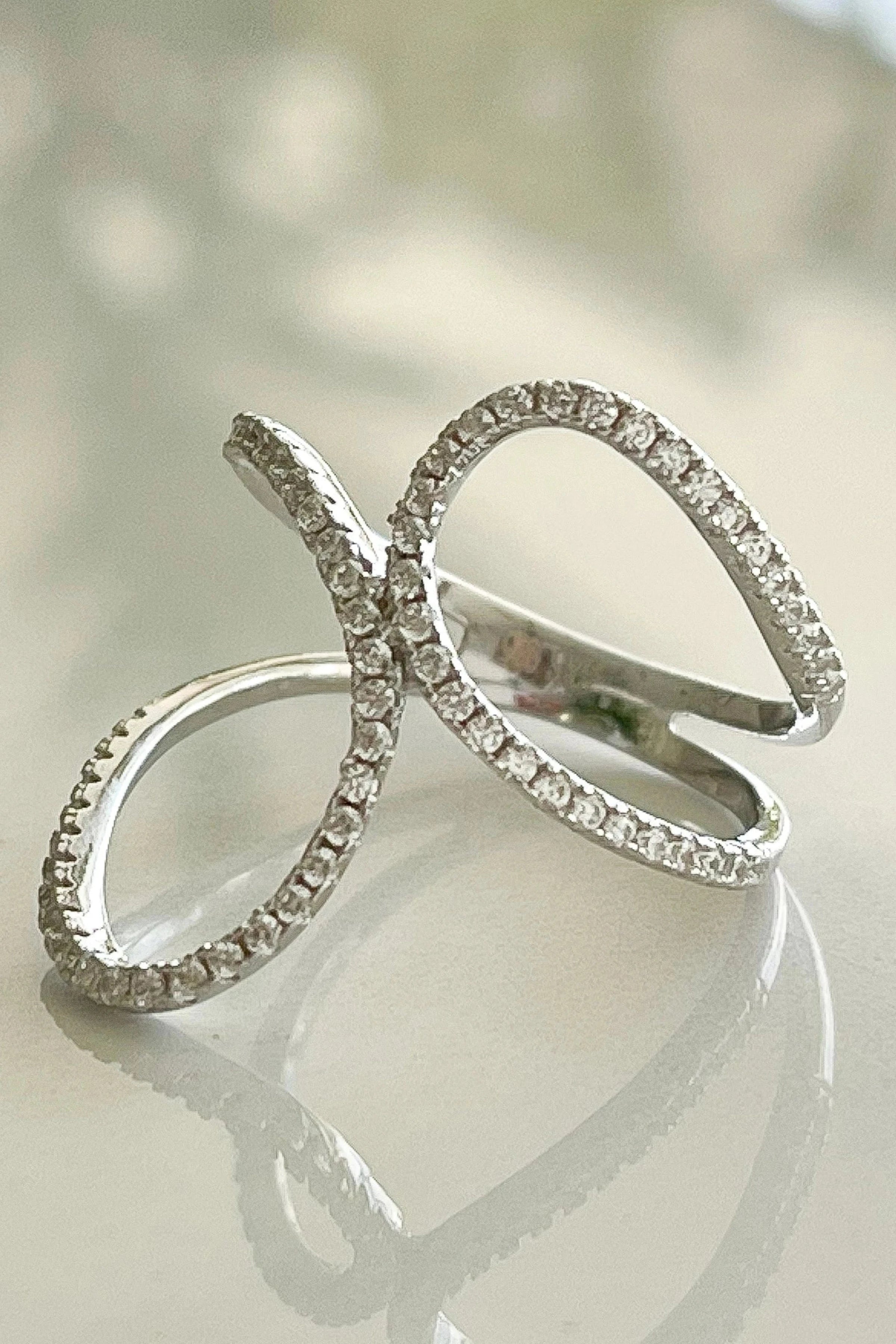 Sorrento Wave Ring on a glass background - L'Atelier Global