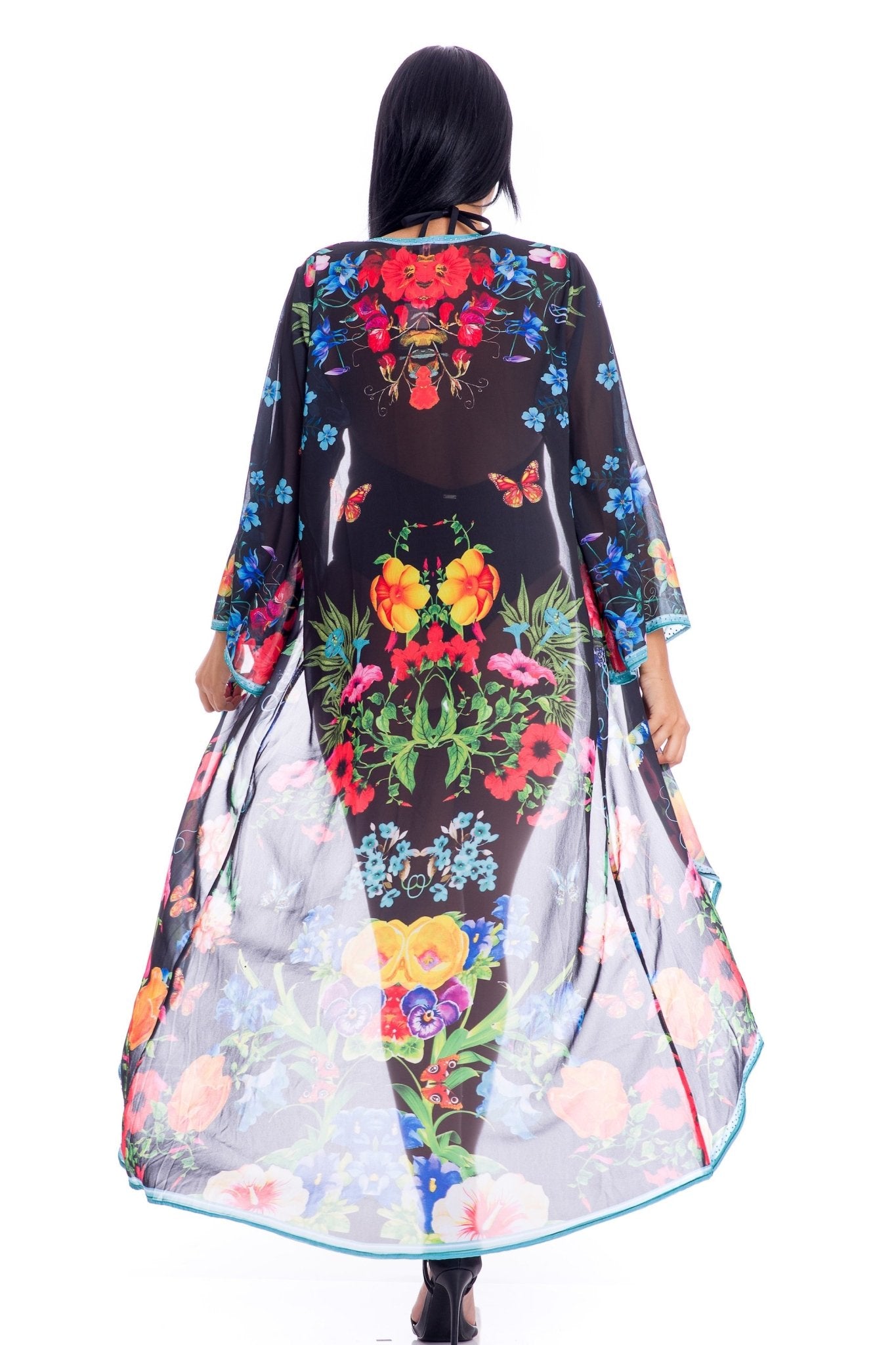 Back view of the Summertime Floral Duster on a model wearing a one black bathing suit on a white background