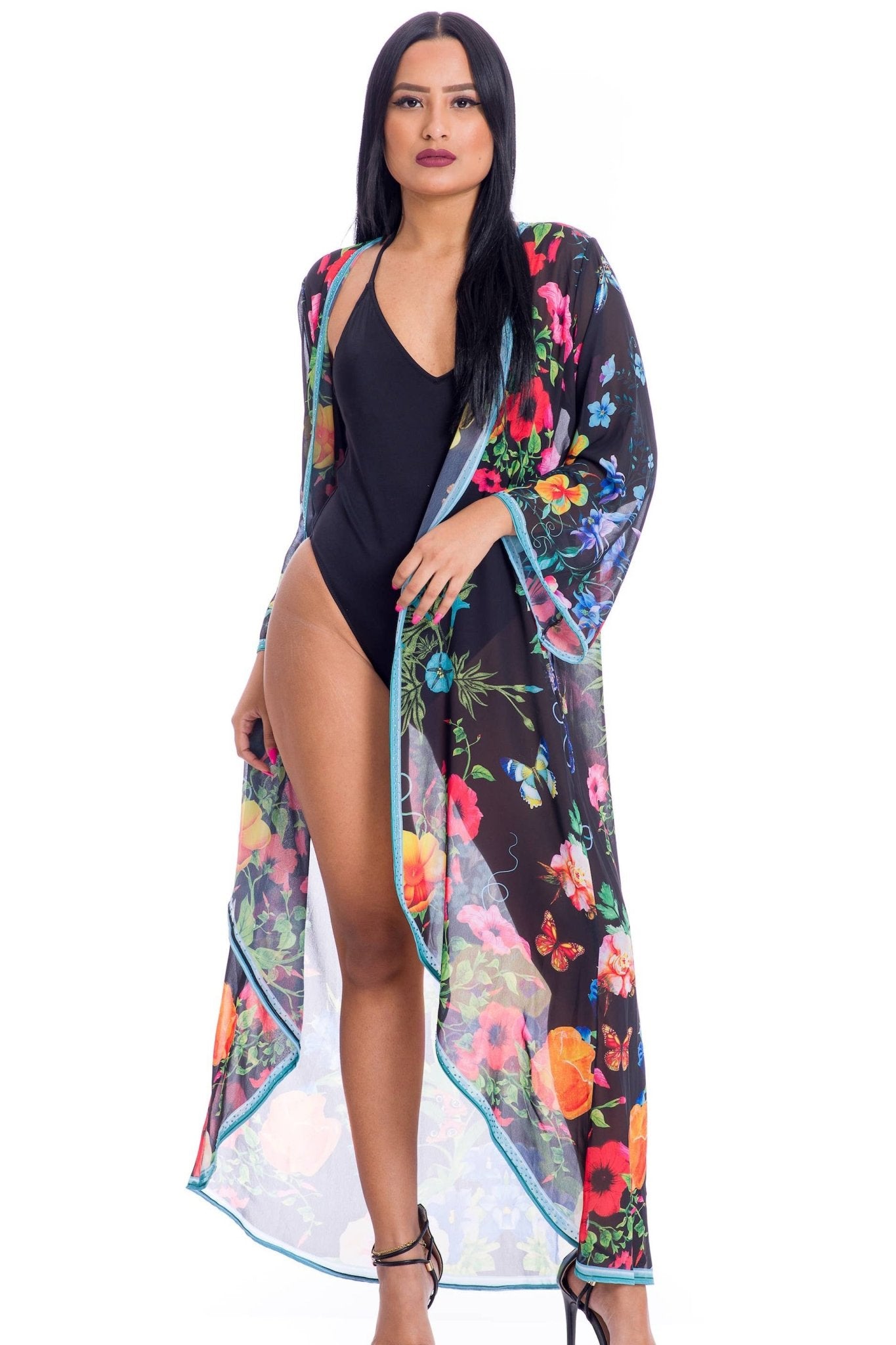 Front view of the Summertime Floral Duster on a model wearing a one black bathing suit on white background