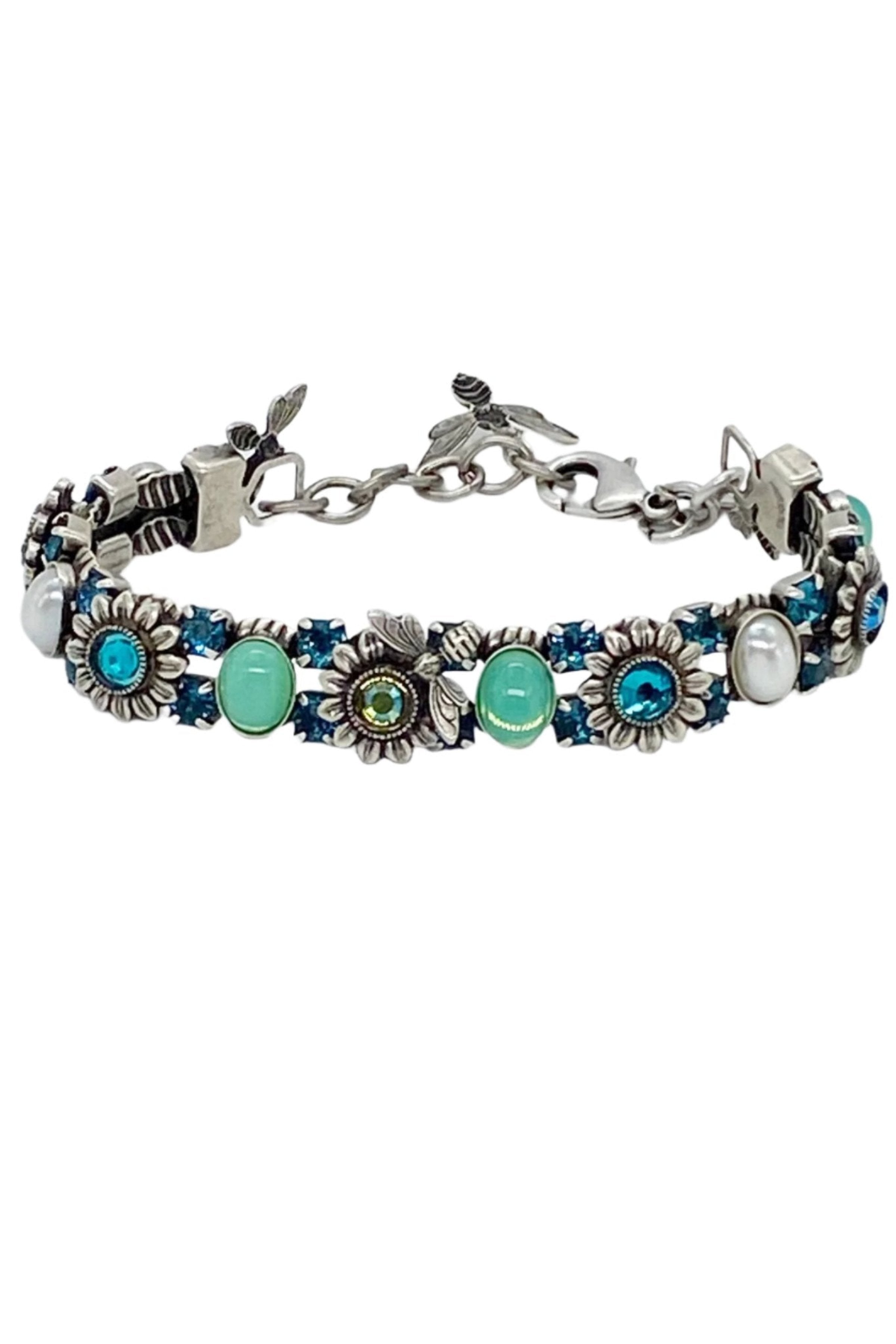 Sunflower and Bee Swarovski Crystal Bracelet in Blues & Greens on a gray background- L'Atelier Global