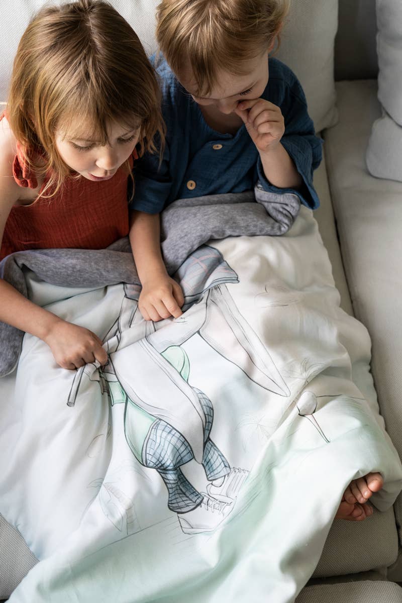 Swing Away Reversible Blanket on a child's bed - L'Atelier Global