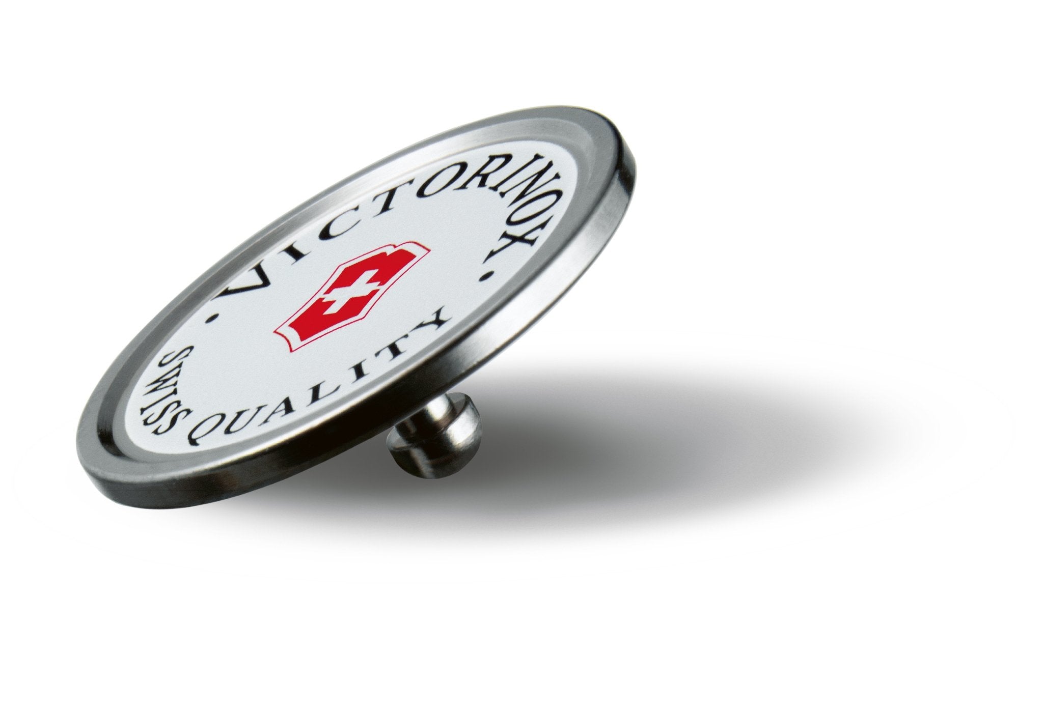 Swiss Golf Tool white and silver Ball marker on a white background