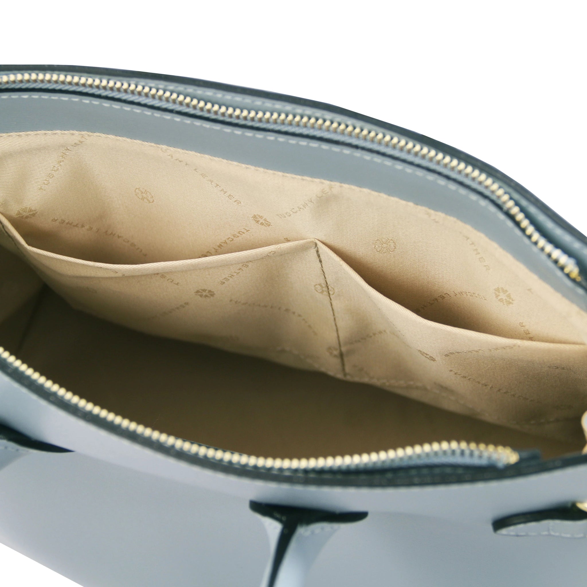 Interior double open pocket view TL Bag Italian Leather Handbag in Light Blue showing light beige interior