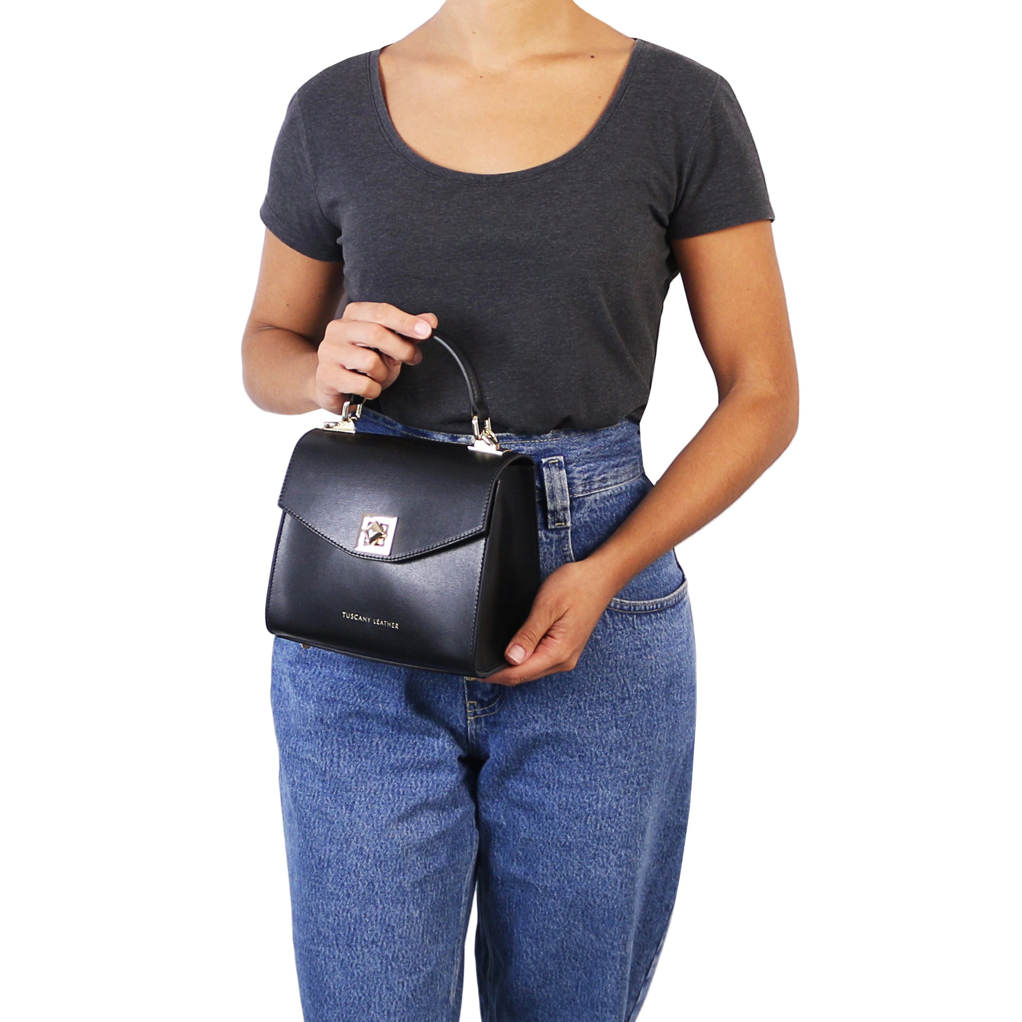 Female holding the TL Bag Italian Leather Mini Bag in black in her hands