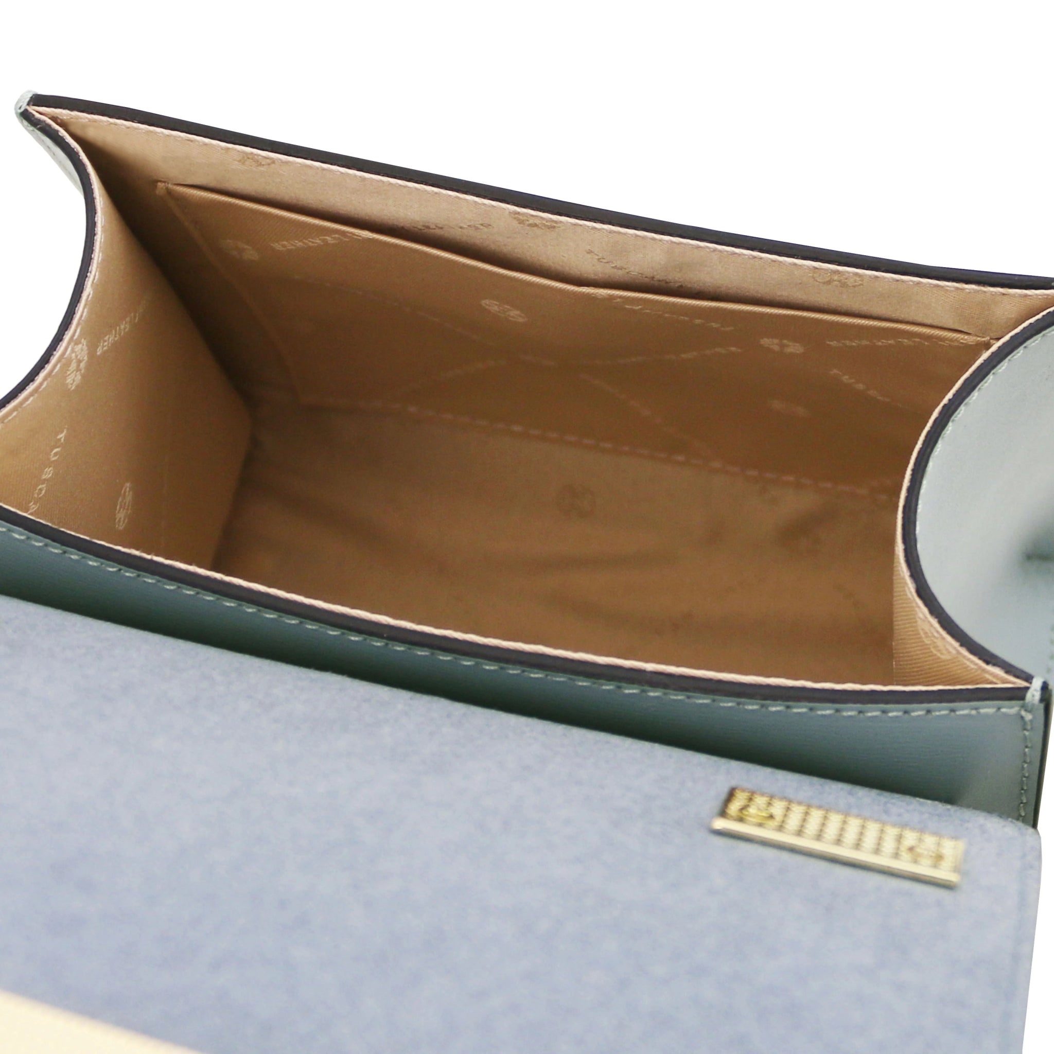 Interior view TL Bag Italian Leather Mini Bag in light blue showing interior open pocket and beige lining