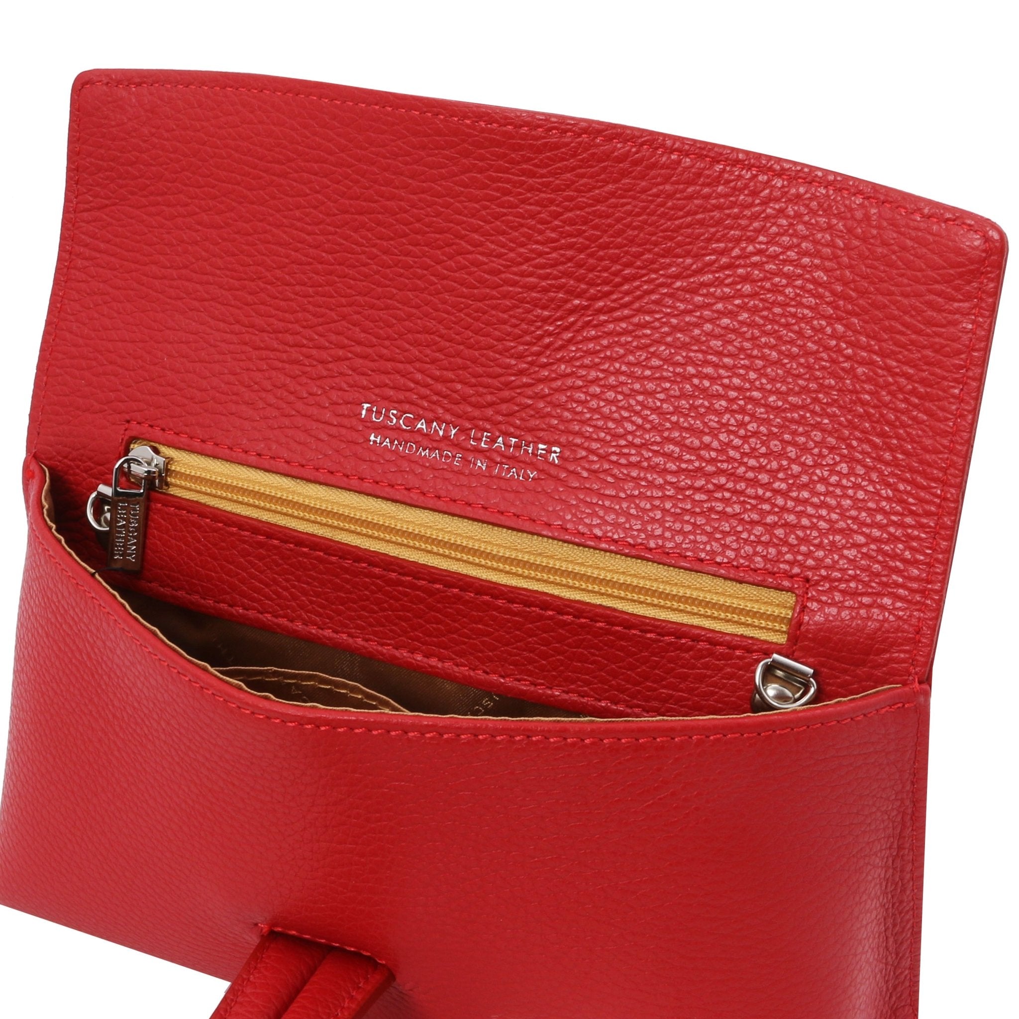 Interior zip pocket view TL Bag Leather Clutch in black showing brown lining