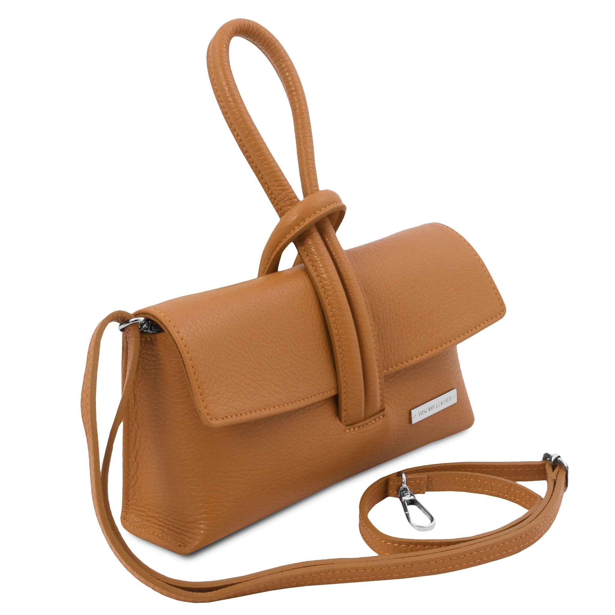 Front side view TL Bag Leather Clutch in cognac showing strap top loop handle and detachable and adjustable crossbody strap