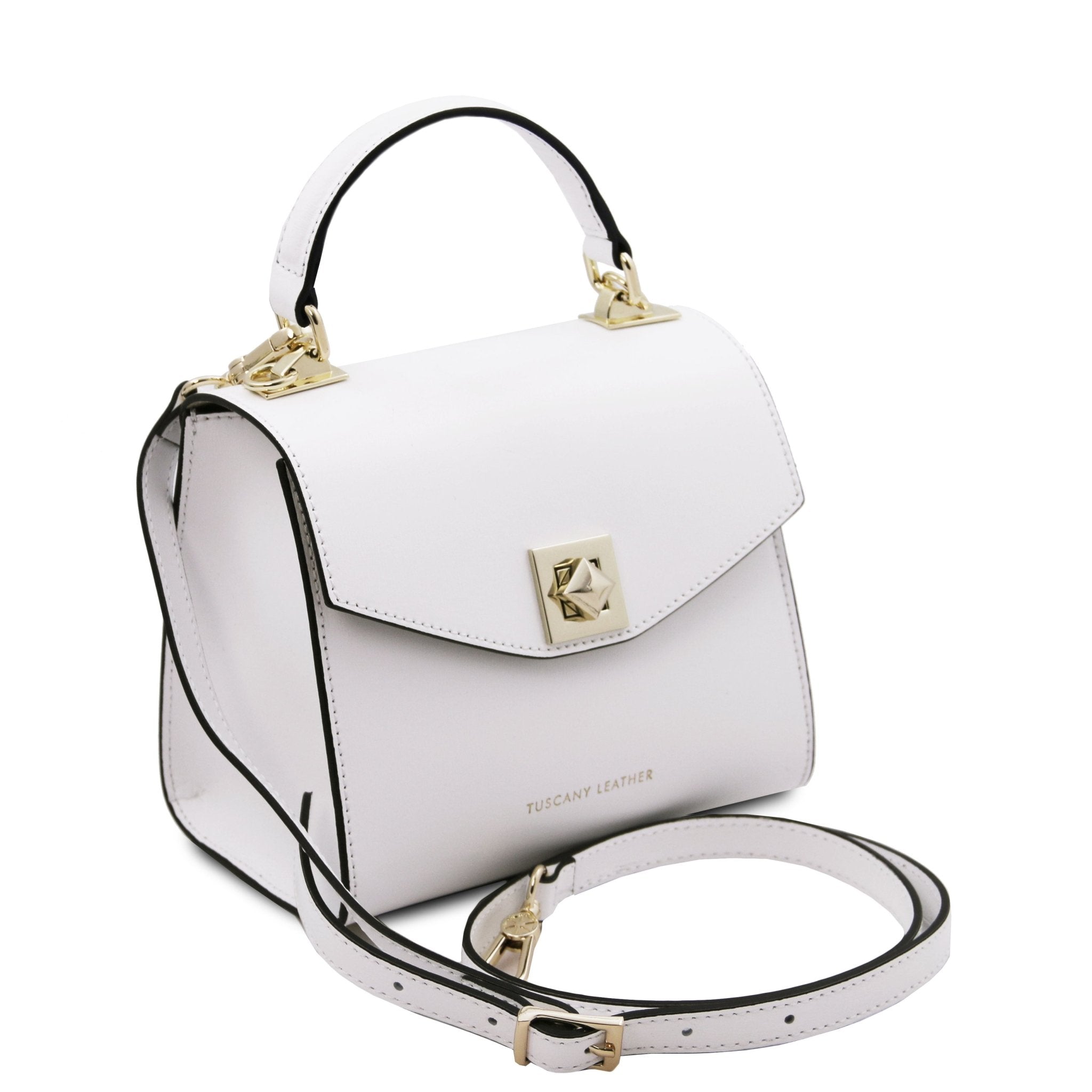 Front angled view TL Bag Italian Leather Mini Bag in white showing front fla closure with magnetic closure, top handle and adjustable and detachable shoulder strap