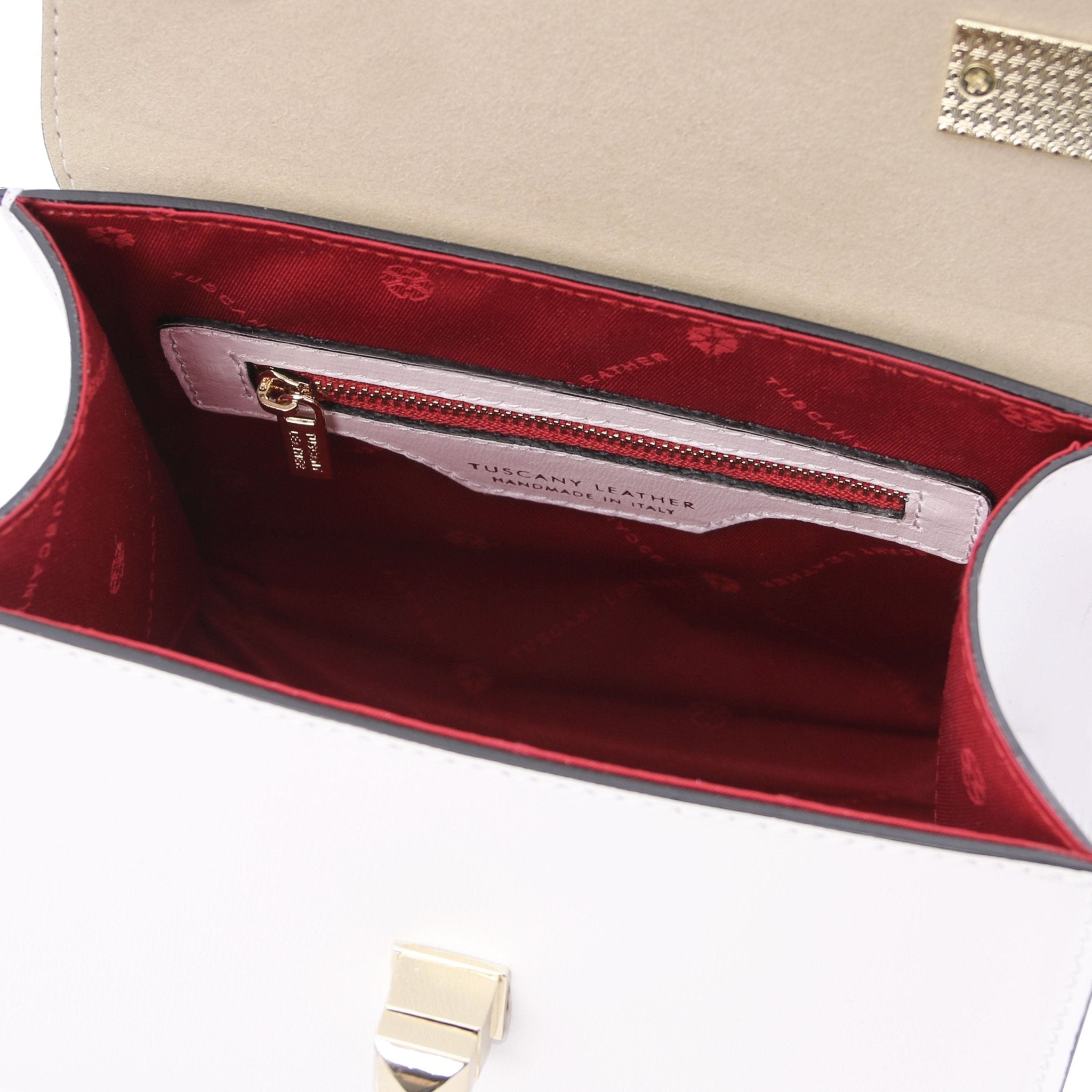 Interior view TL Bag Italian Leather Mini Bag in white showing interior zip pocket and red lining.