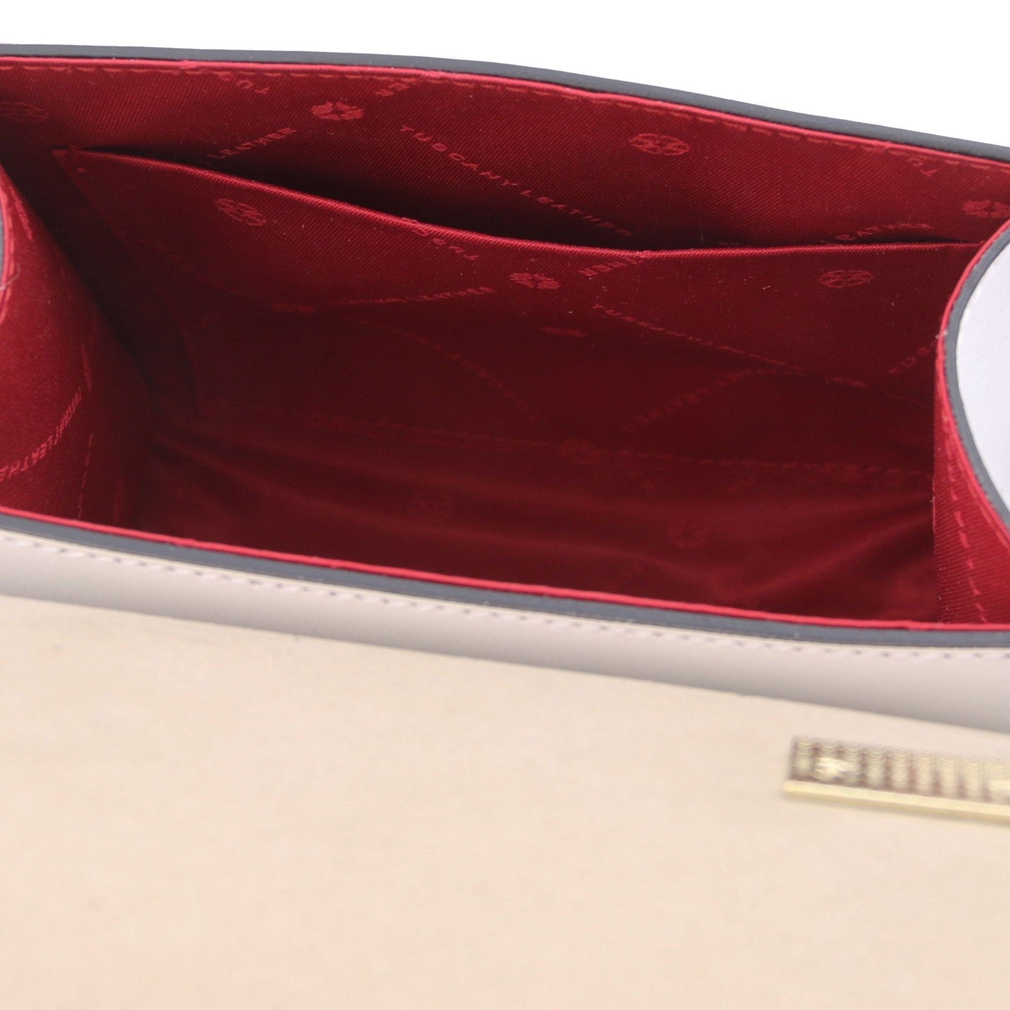 Interior view TL Bag Italian Leather Mini Bag in white showing interior open pocket and red lining
