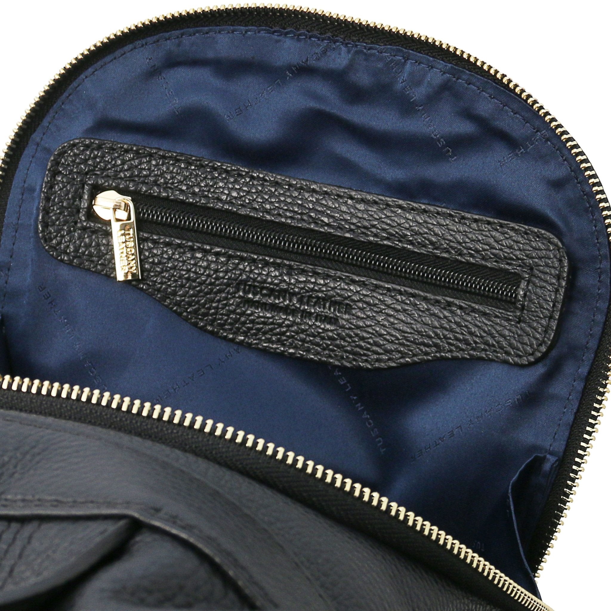 TL Bag Soft Leather Backpack in black showing interior zip pocket and navy liming, with blue lining