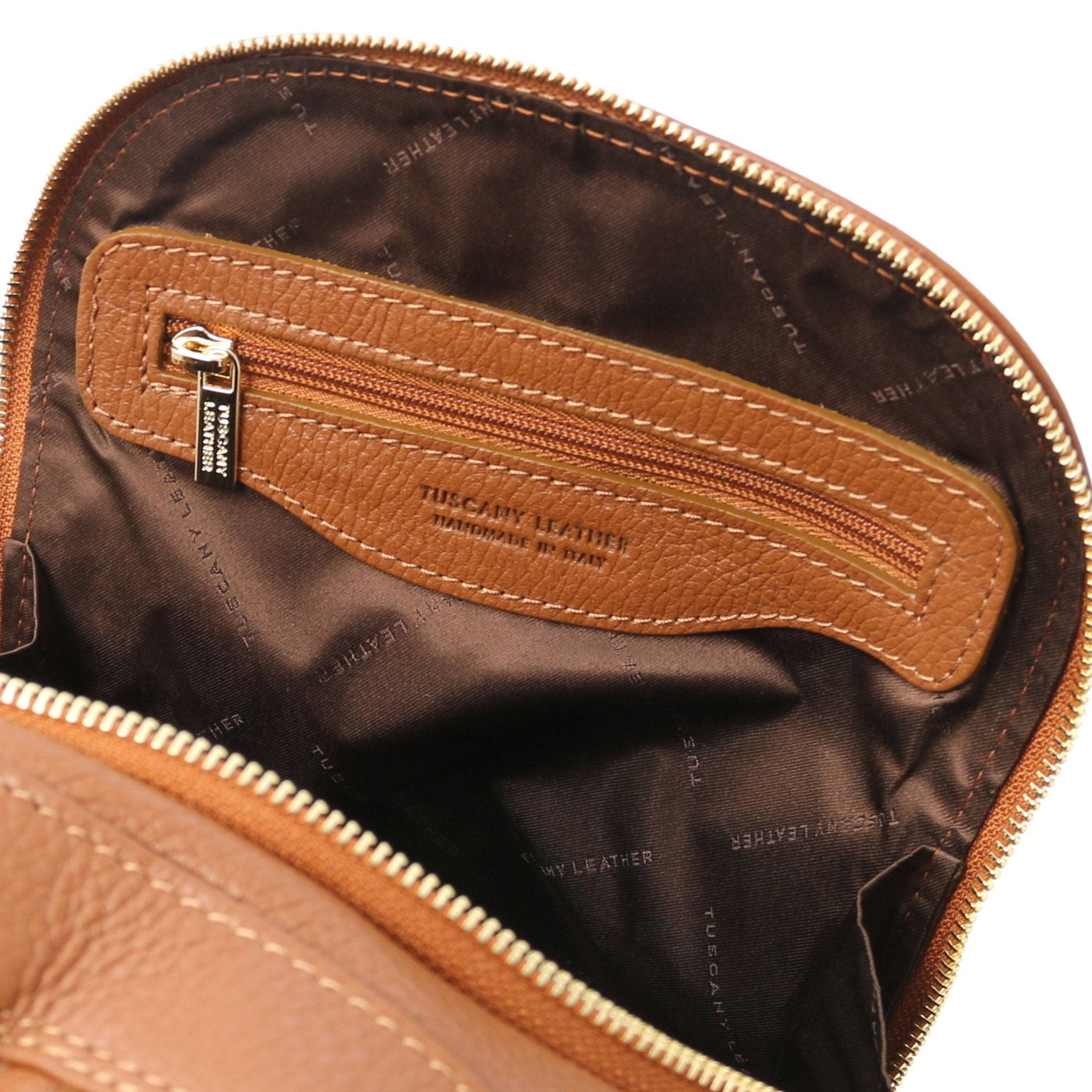 TL Bag Soft Leather Backpack in cognac showing interior zip pocket and dark brown lining, with brown lining
