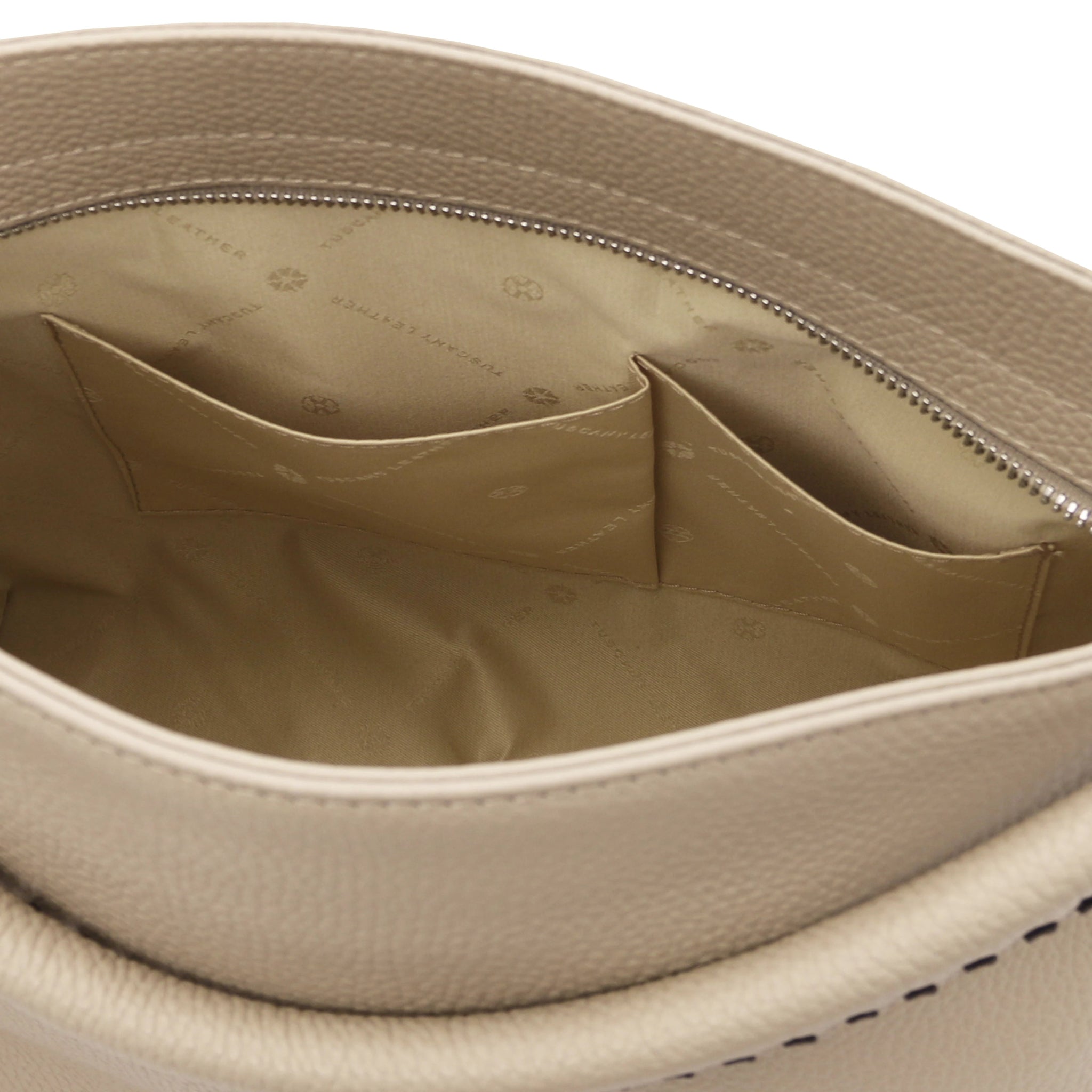 Interior view of the TL Bag Soft Leather Handbag in Beige showing two opened pockets and beige lining on a white background.