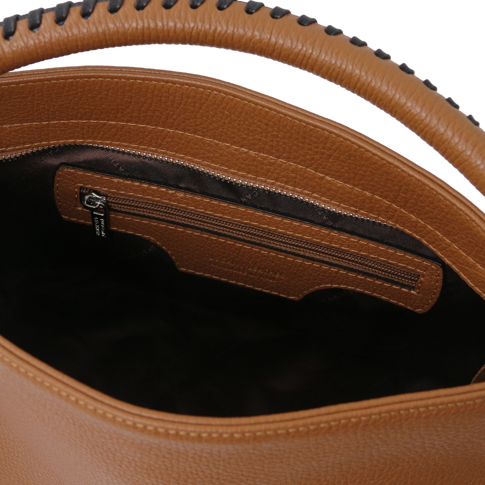 Interior view of the TL Bag Soft Leather Handbag in Cognac showing a zippered pocket and dark brown lining on a white background.