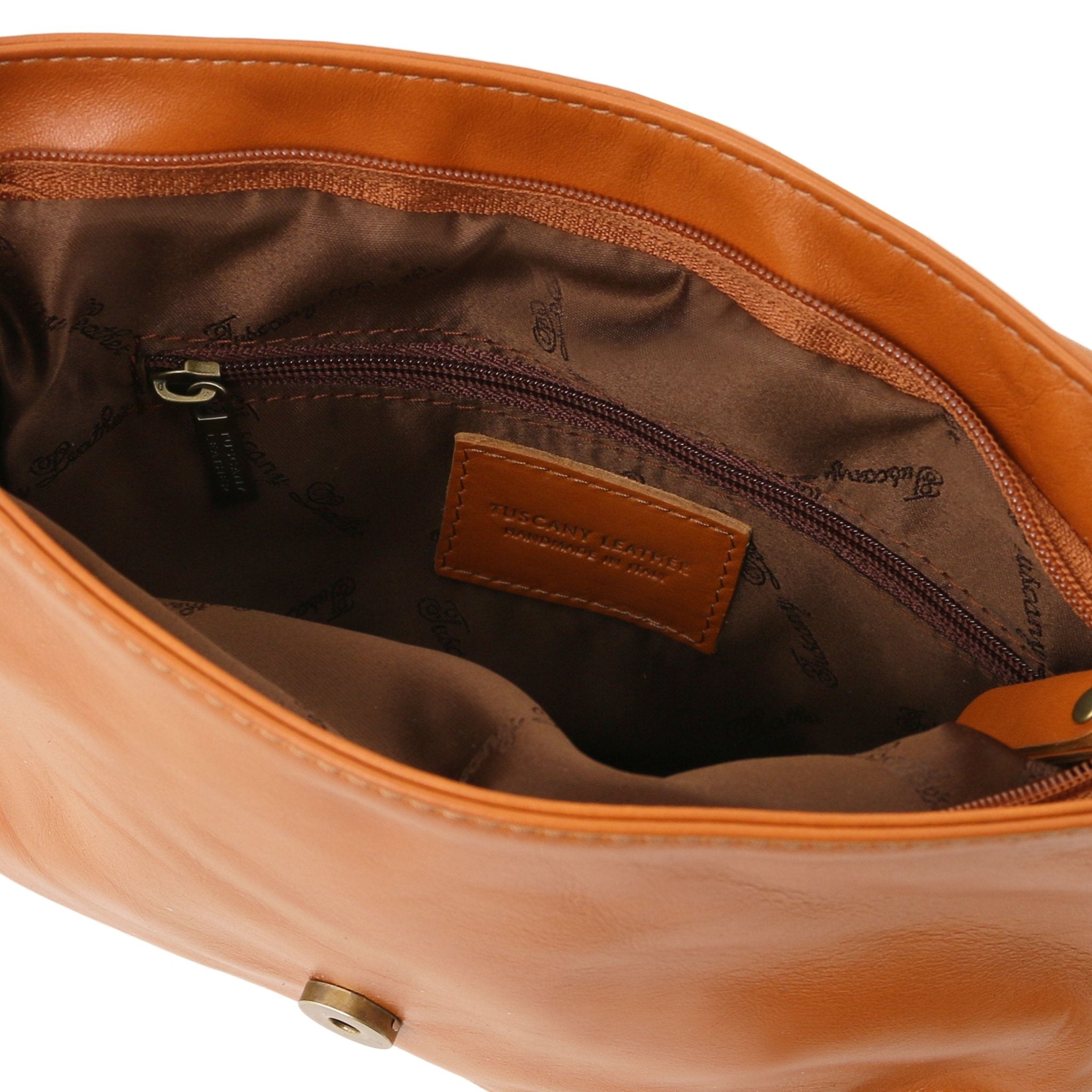 Interior view TL Bag Soft Leather Shoulder Bag with Tassel Detail Small Size in cognac showing zippered pocket and brown lining