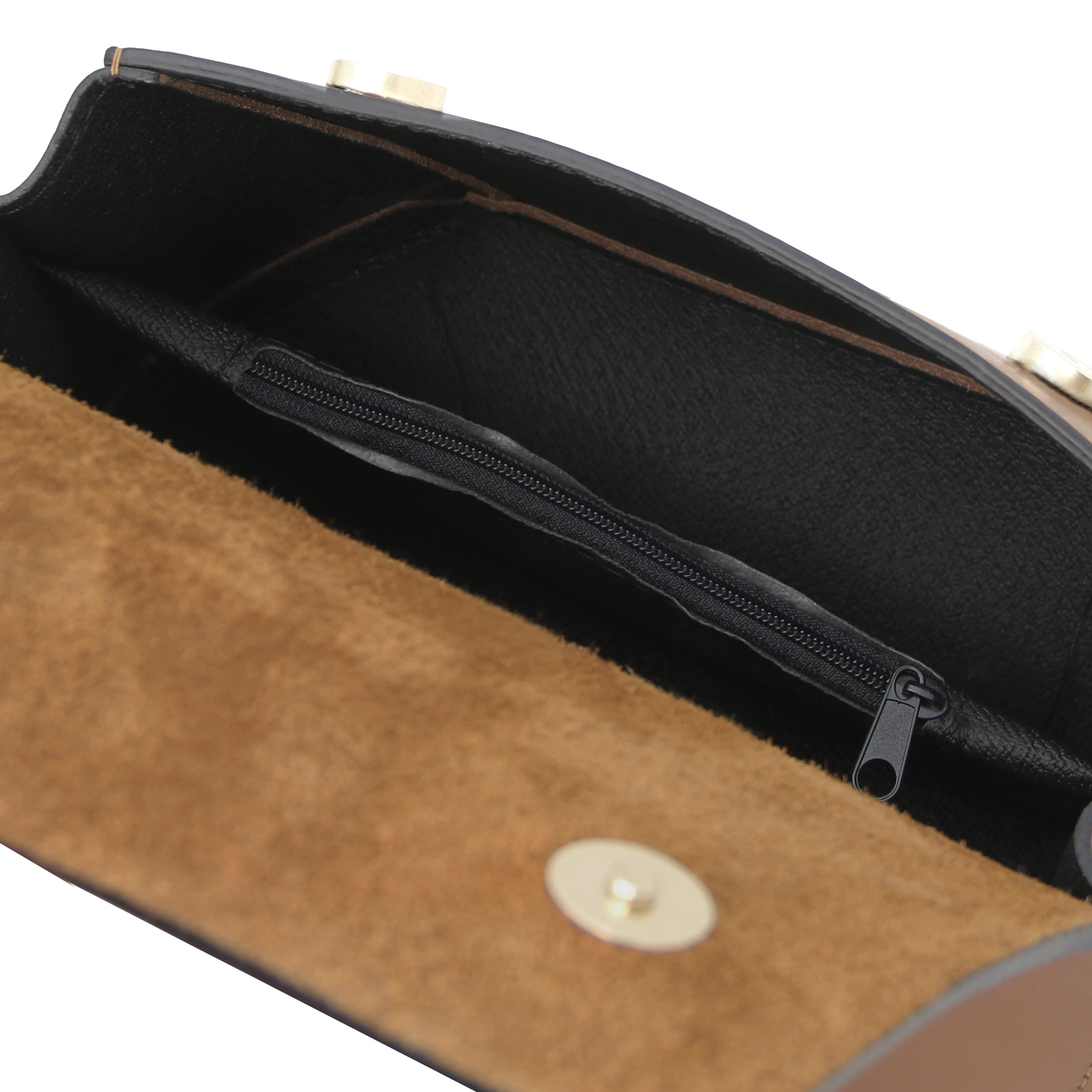Interior zip pocket view TL Leather Assymetrical Shoulder Bag in Cognac showing magnetic button closures