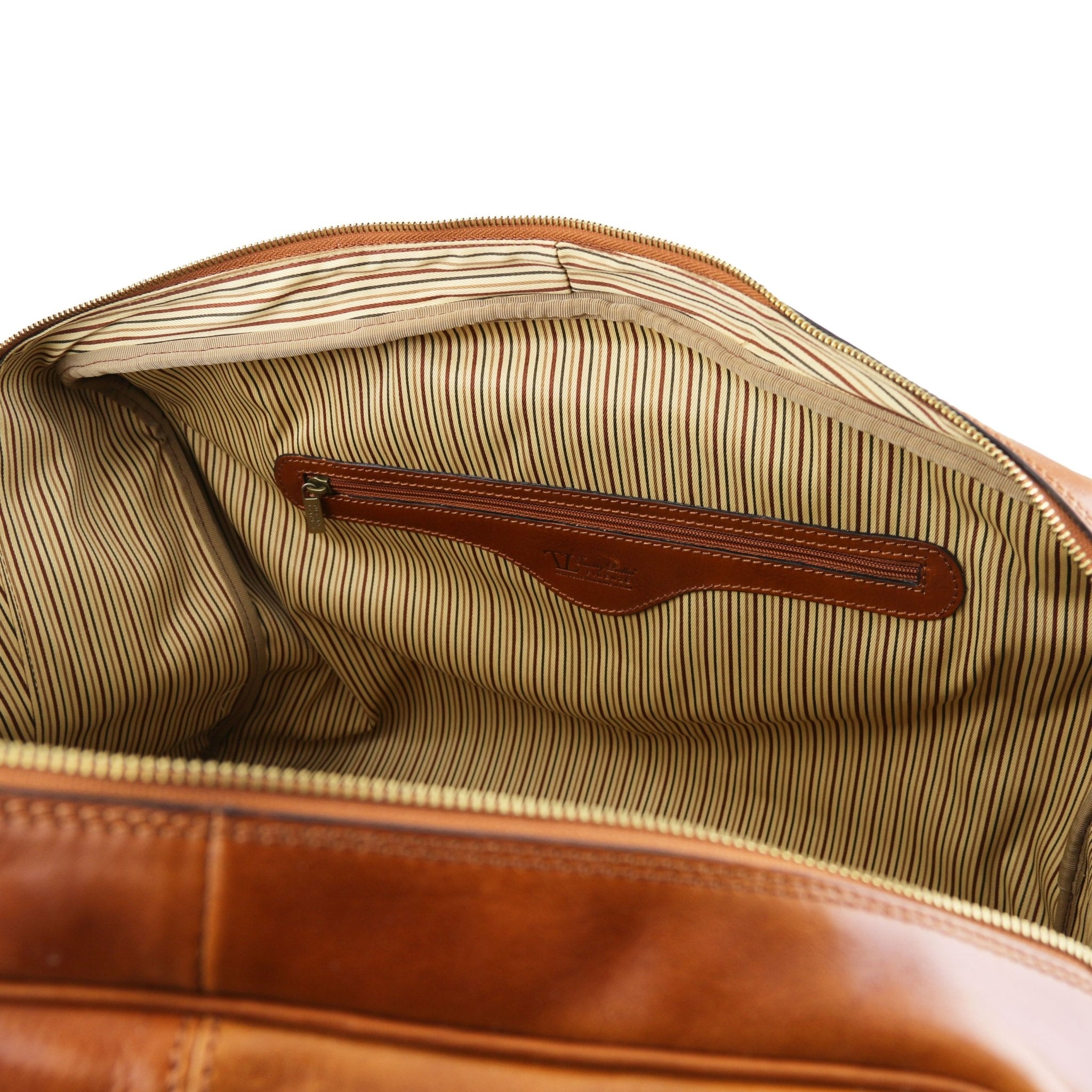 Interior zippered pocket view TL Voyager Leather Travel Bag with Front Pocket in Honey on a white background