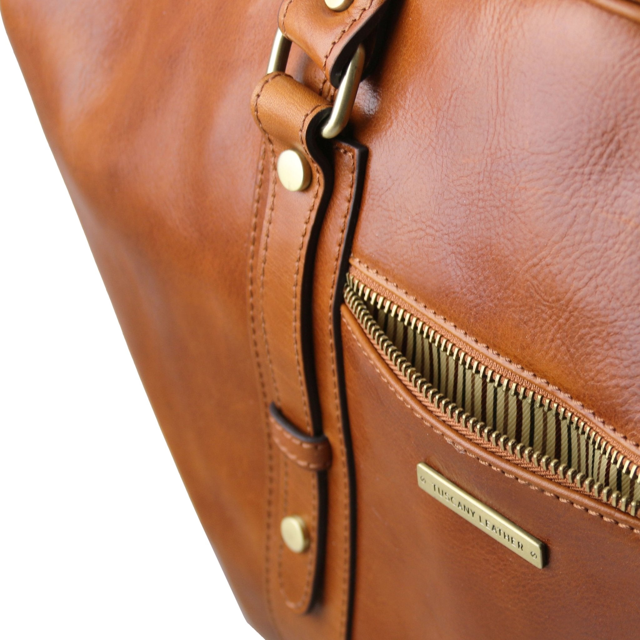 Exterior zippered pocket view TL Voyager Leather Travel Bag with Front Pocket in Honey lined with the same cotton striped fabric as the interior