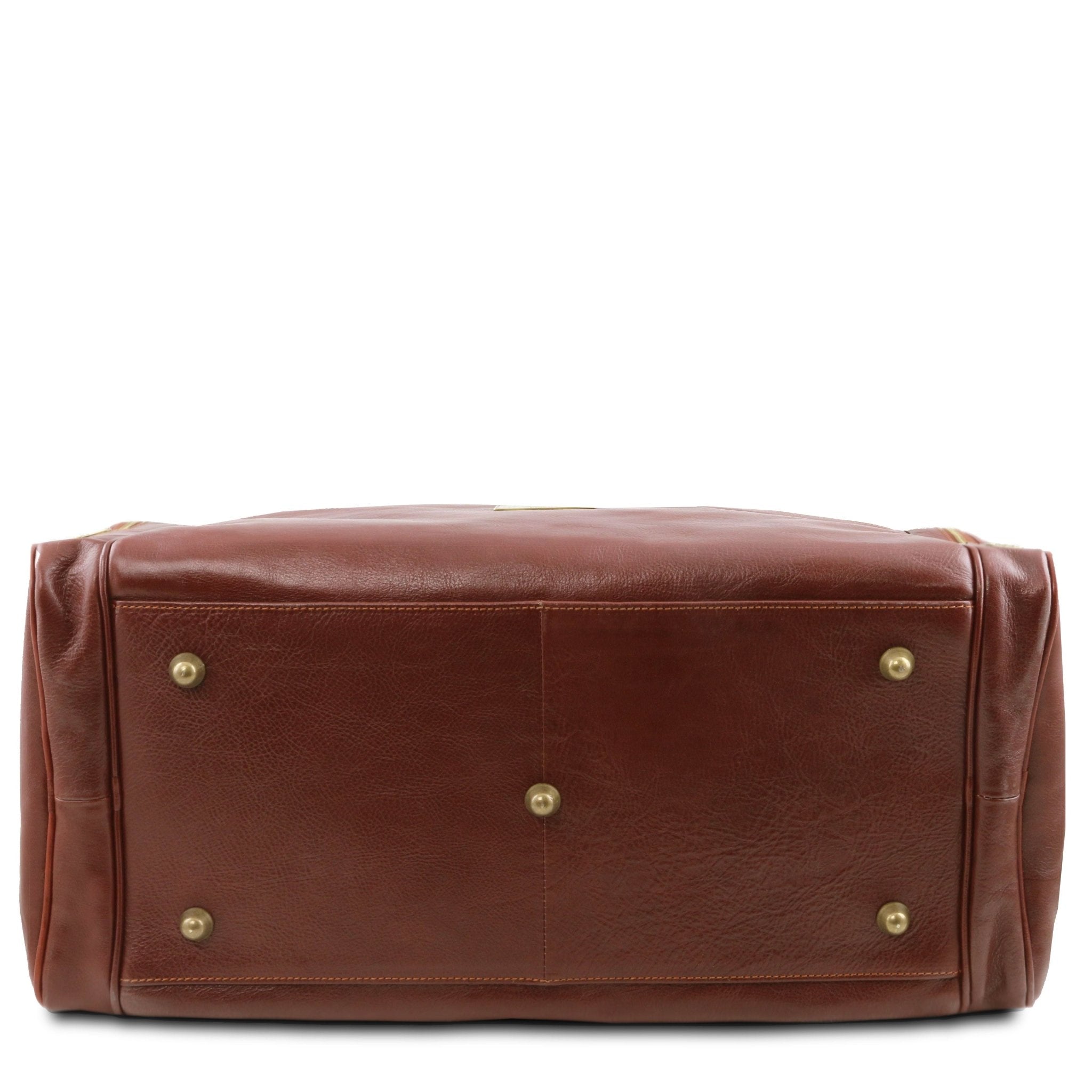 Bottom view TL Voyager Travel Leather Bag with Side Pockets in brown on a white background showing golden protective feet