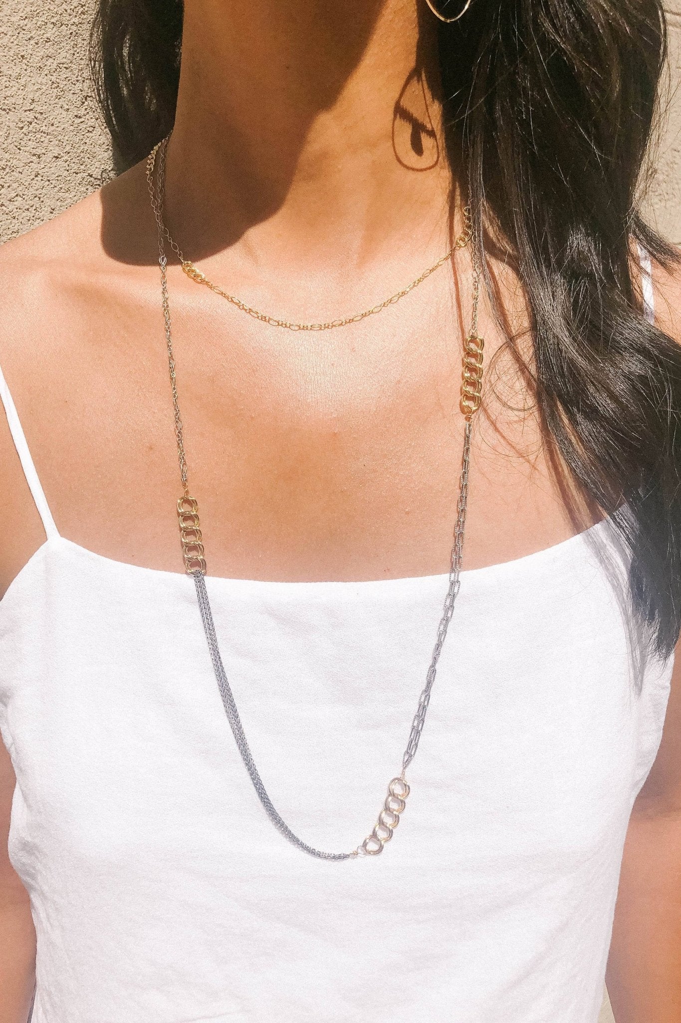 Trace Trio Curb Chain Necklace worn by a model wearing a white cotton tank top- L'Atelier Global
