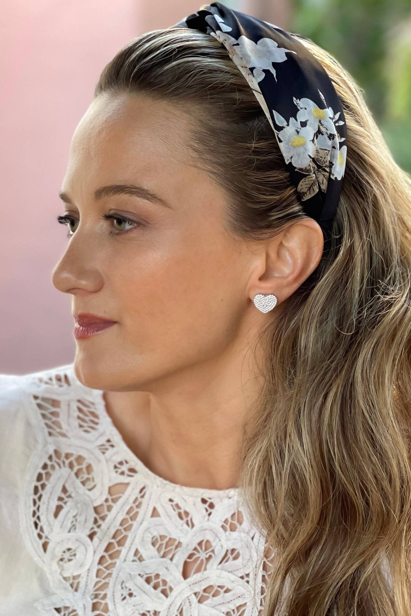 Treviso Heart to Heart Stud Earrings on a model presenting her left ear.