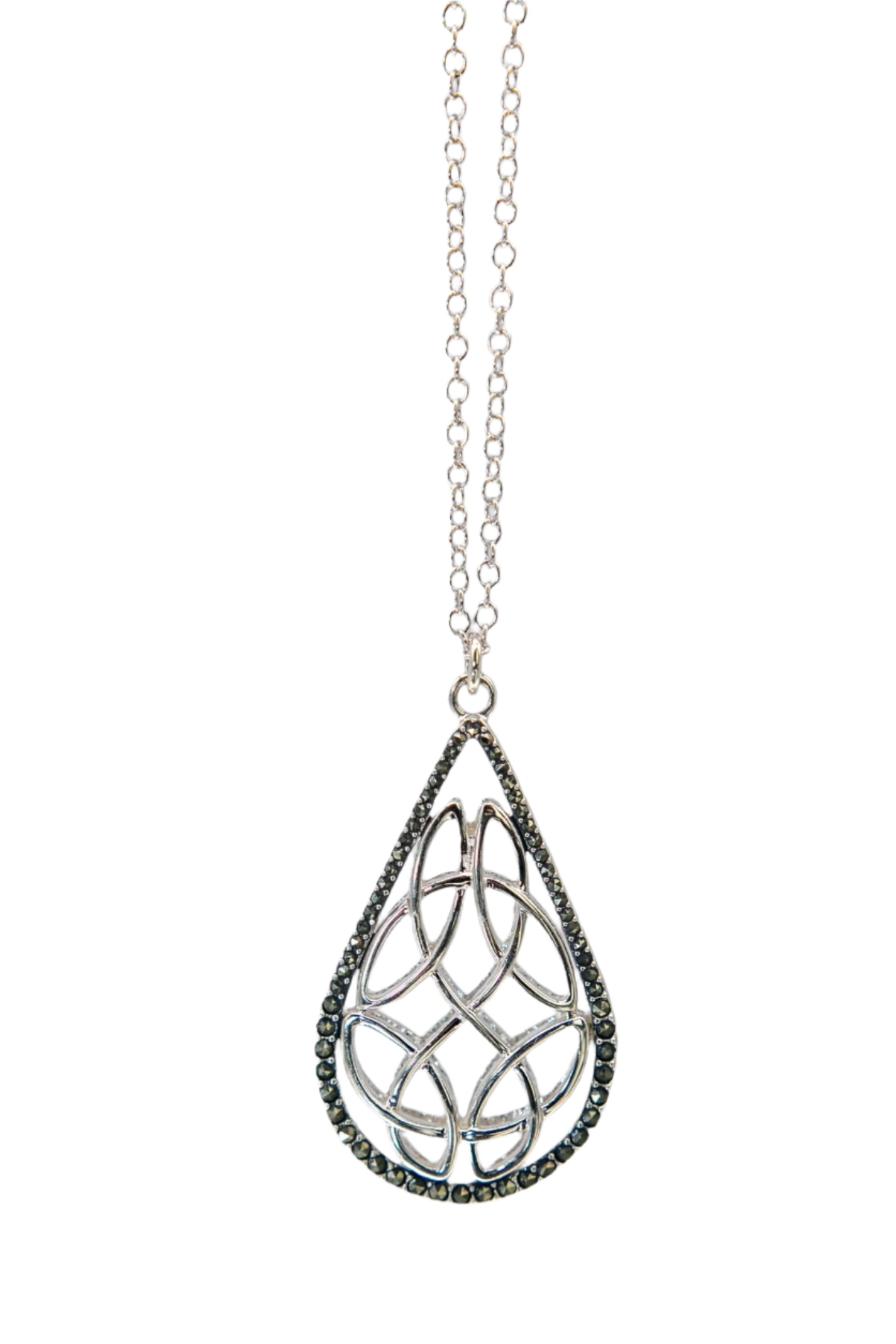 Trinity Reversible Pendant Necklace marcasite side hanging in front of a gray background- L'Atelier Global