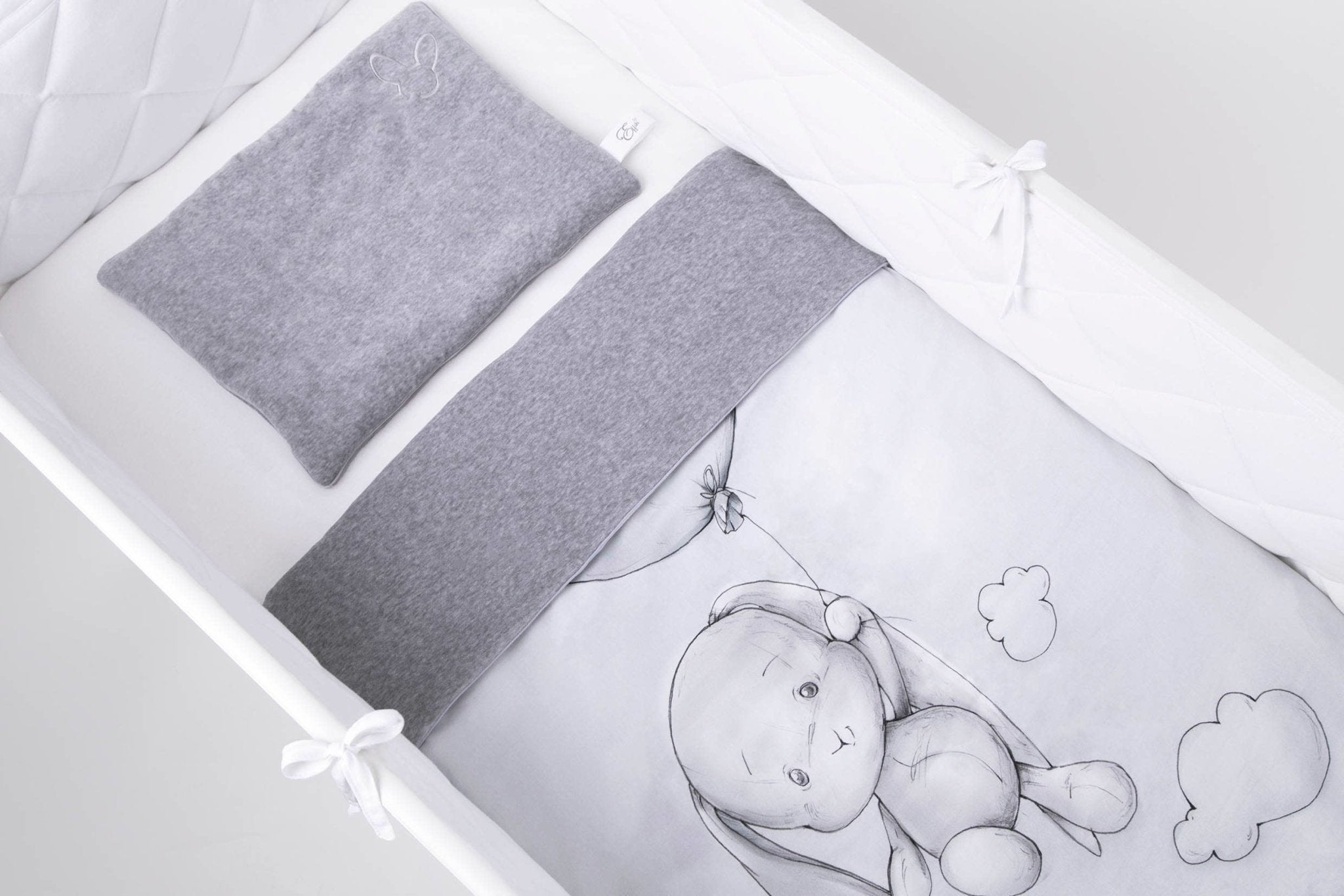 Up Up and Away Reversible Blanket on a child's bed - L'Atelier Global