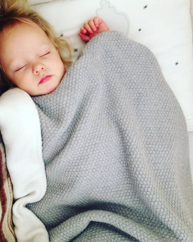 Wool & Fleece Double Blanket styled in bed covering a young girl - L'Atelier Global