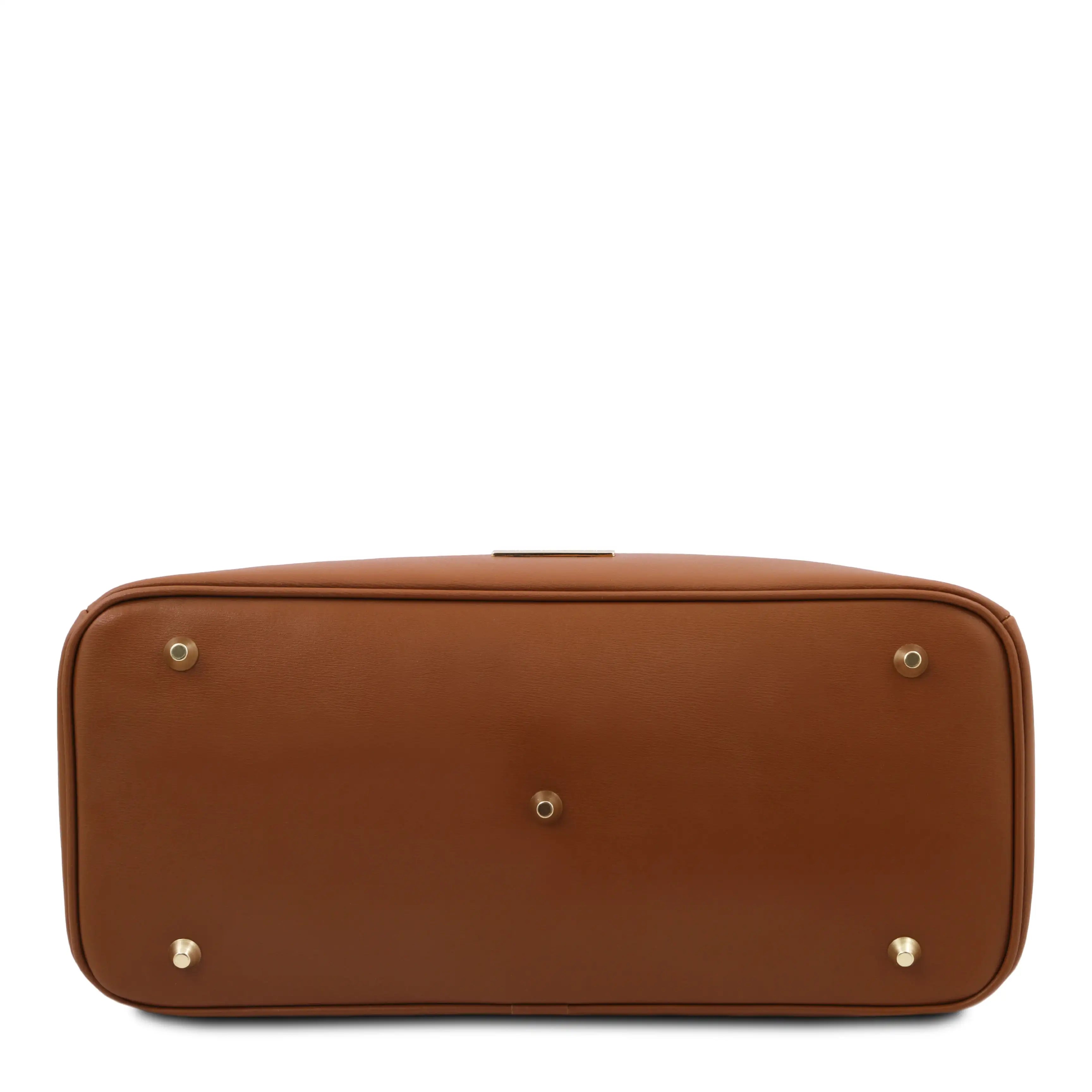Brown leather bag with gold studs on a white background