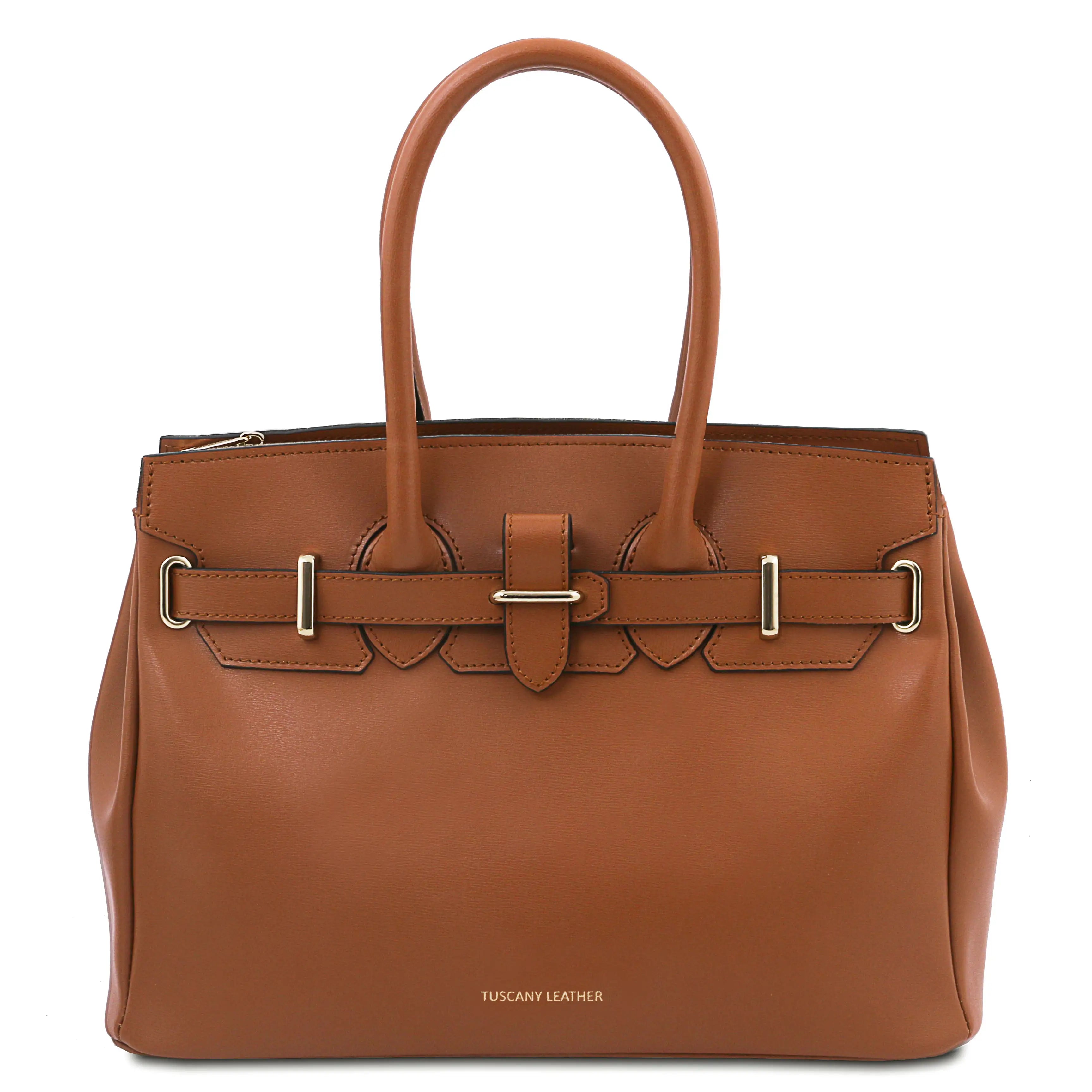 Brown leather handbag with gold accents on a white background